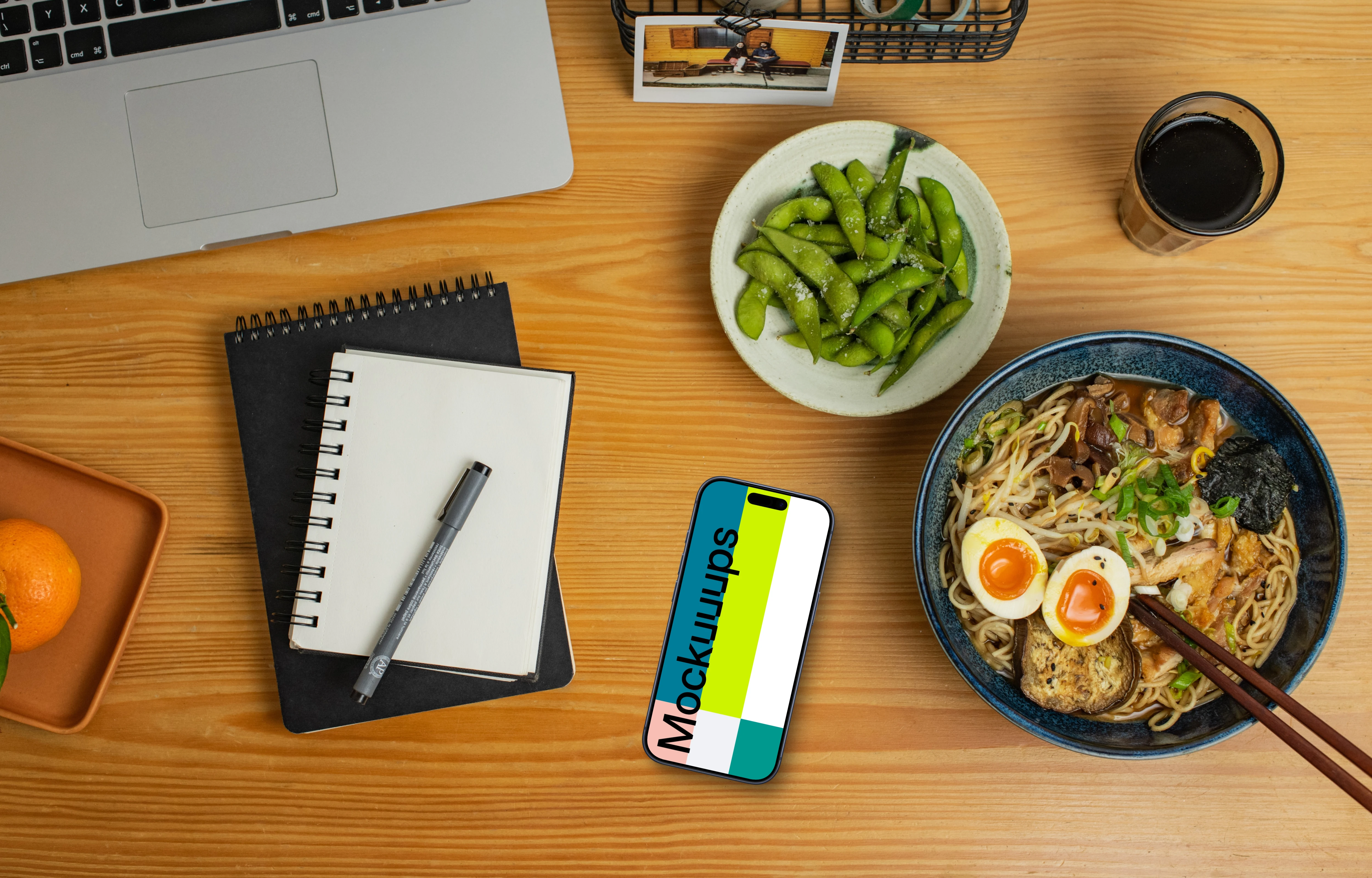 Smartphone mockup on a table with ramen