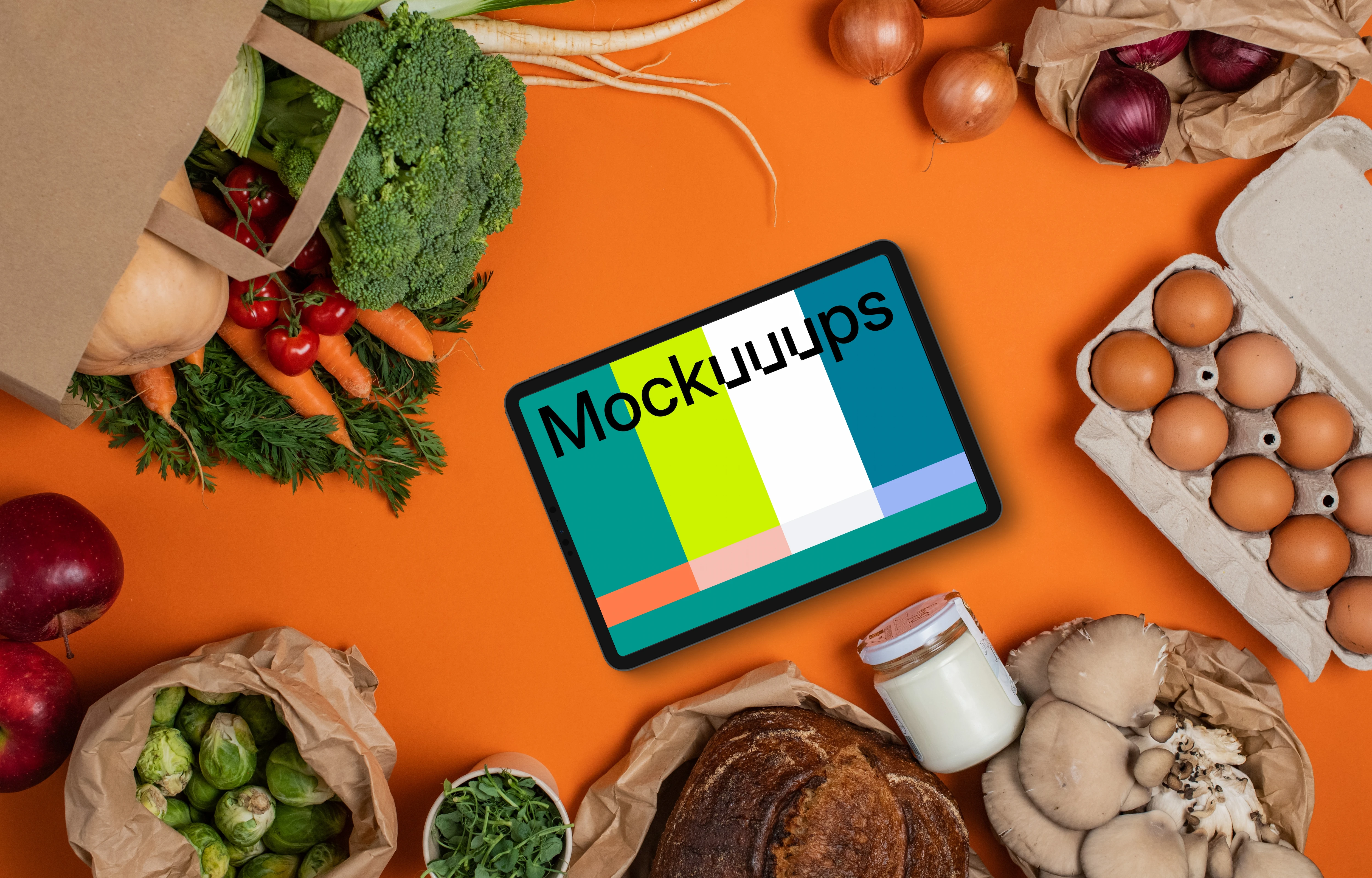 Tablet mockup surrounded by fresh groceries