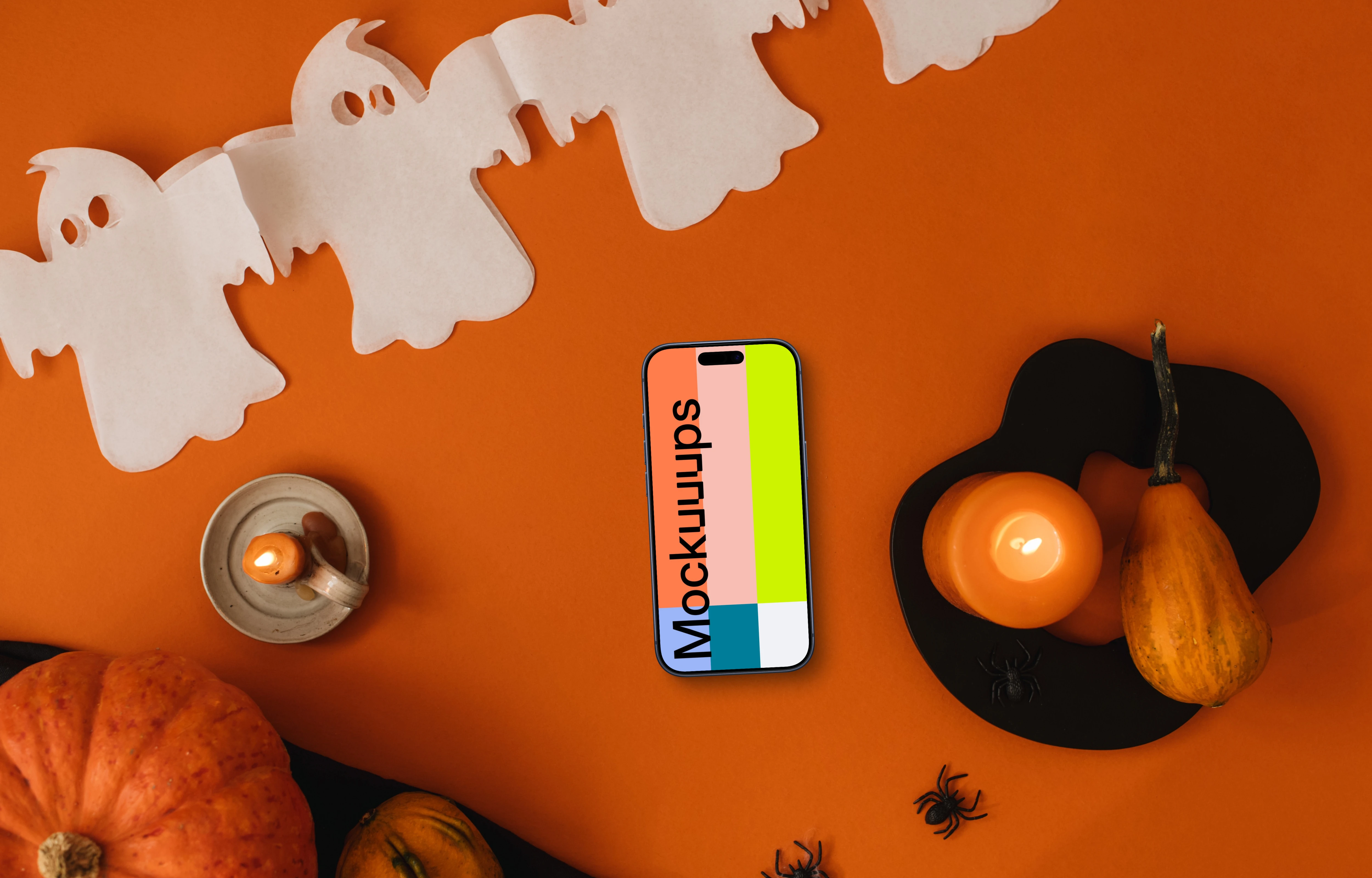 Halloween background mockup with a phone and pumpkin