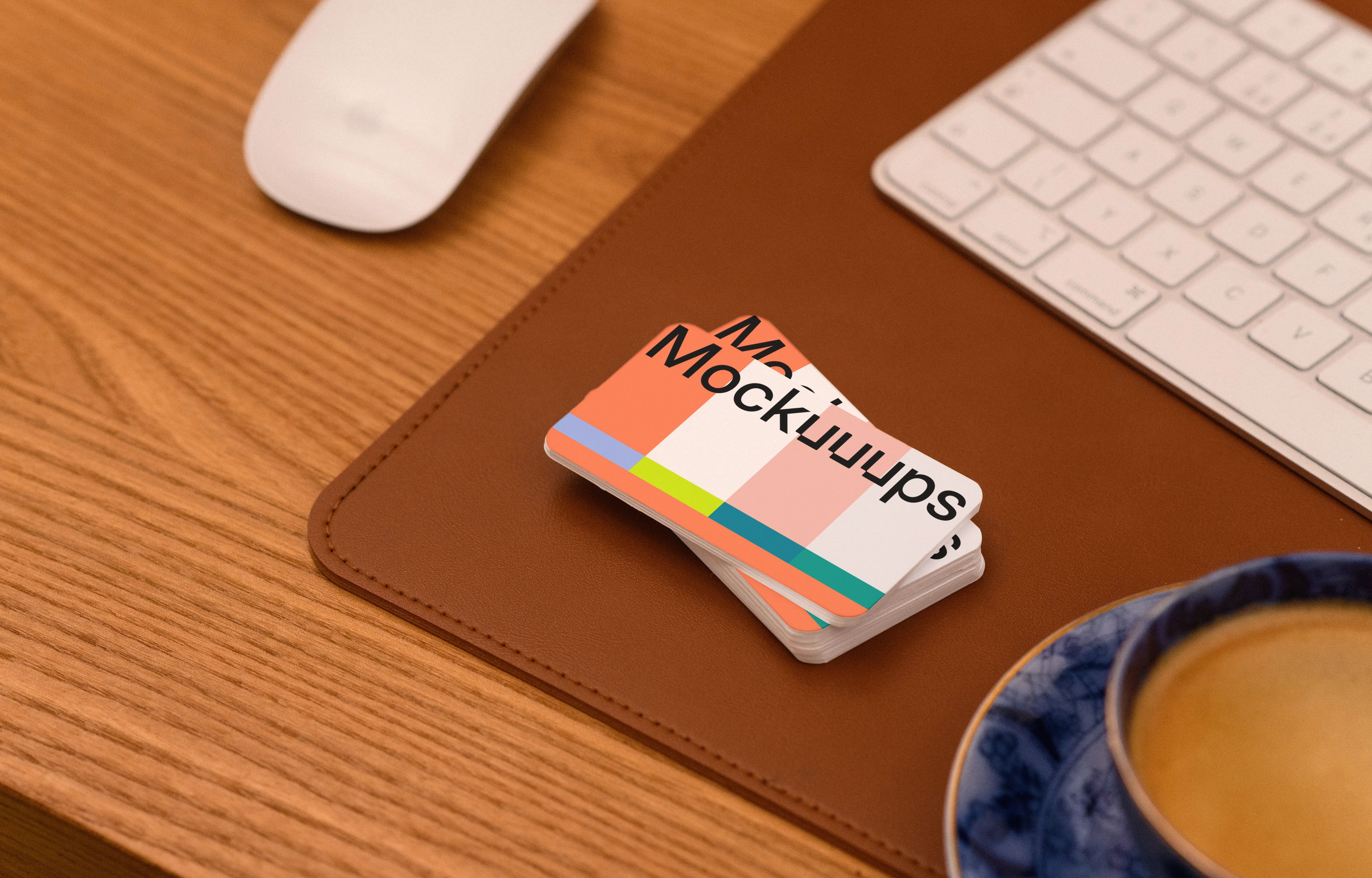Business card mockup on a leather desk pad