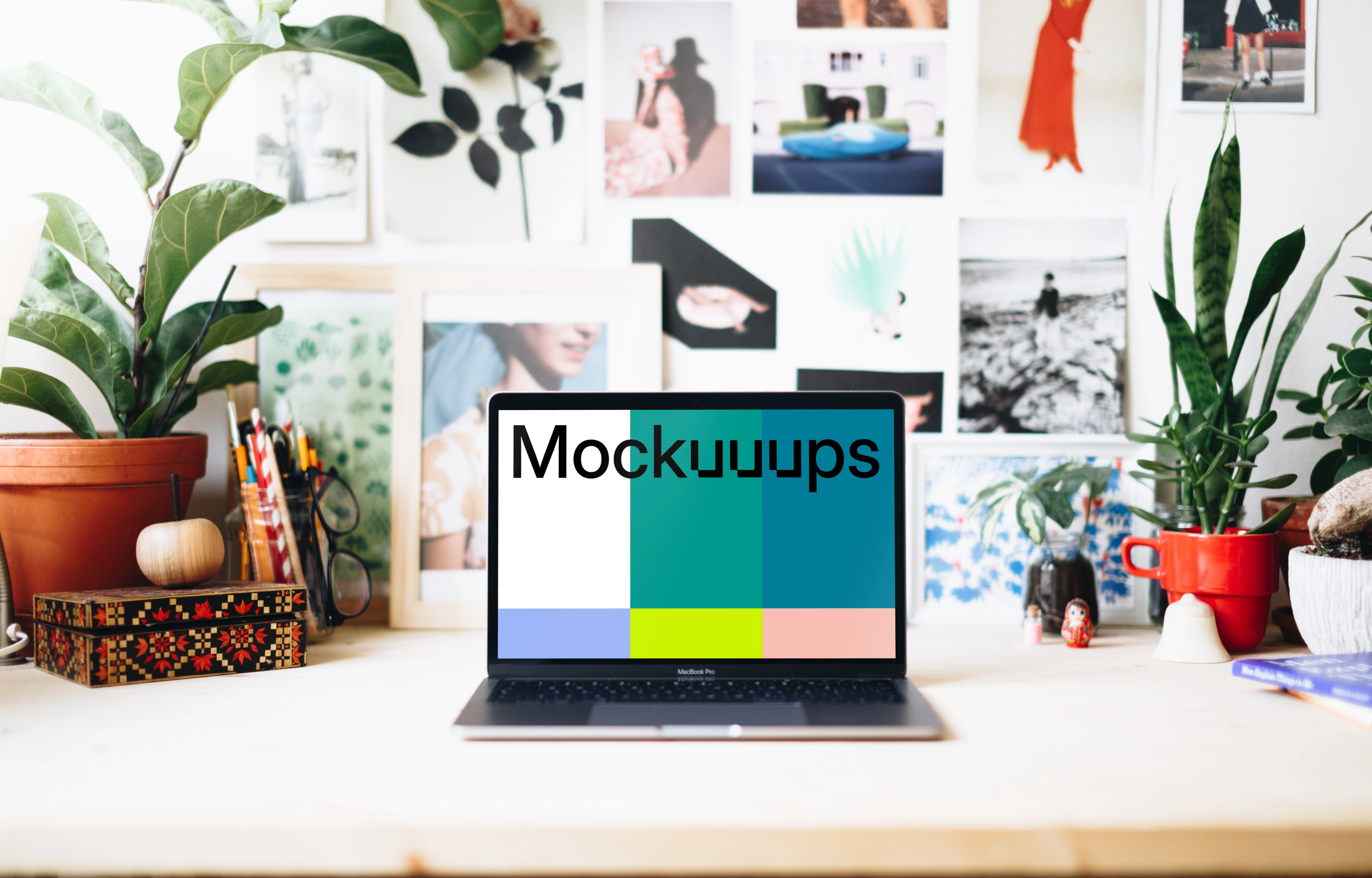 Creative workspace mockup with front view of Macbook Pro