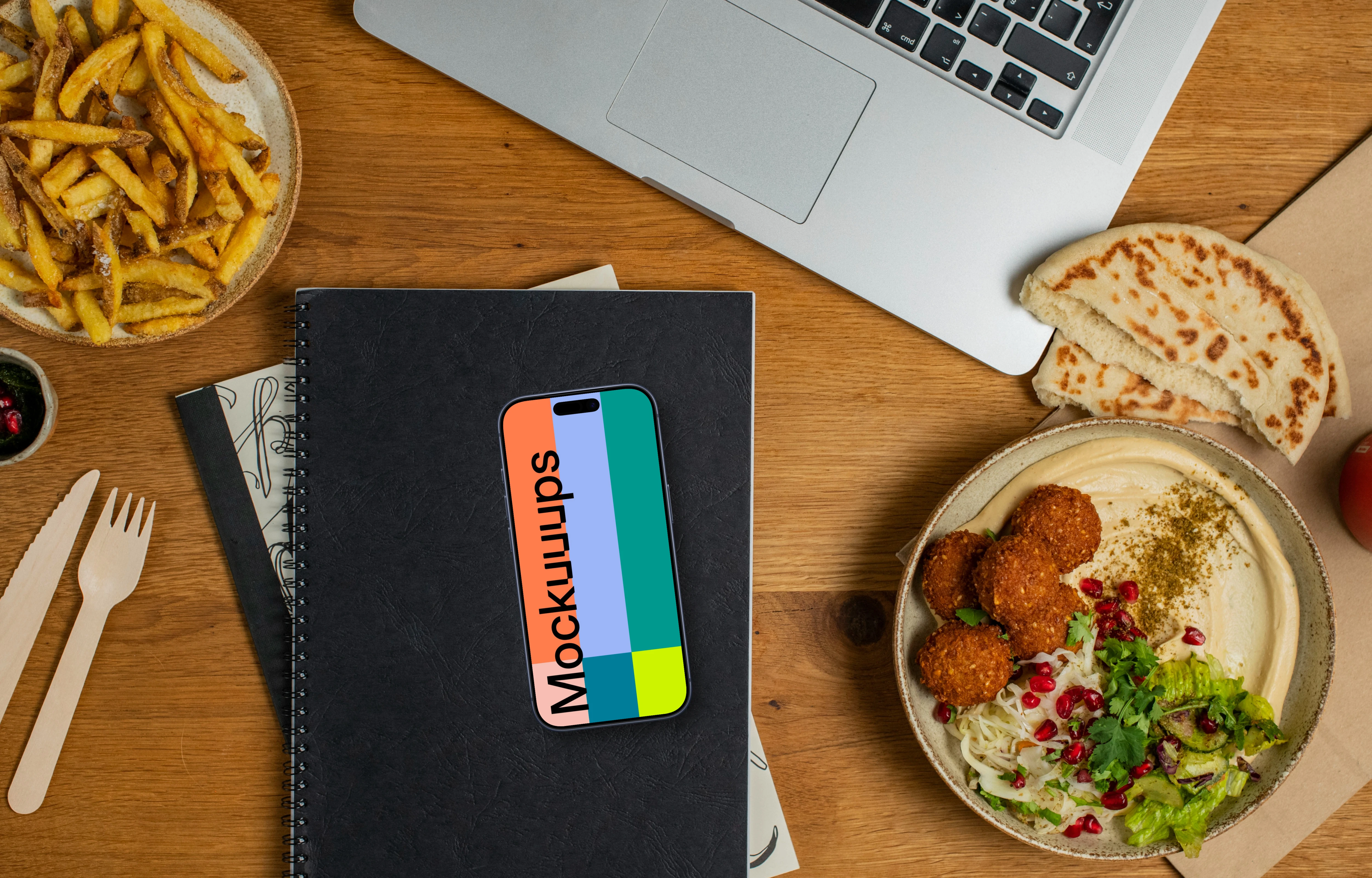 Falafel with hummus next to the Smartphone mockup