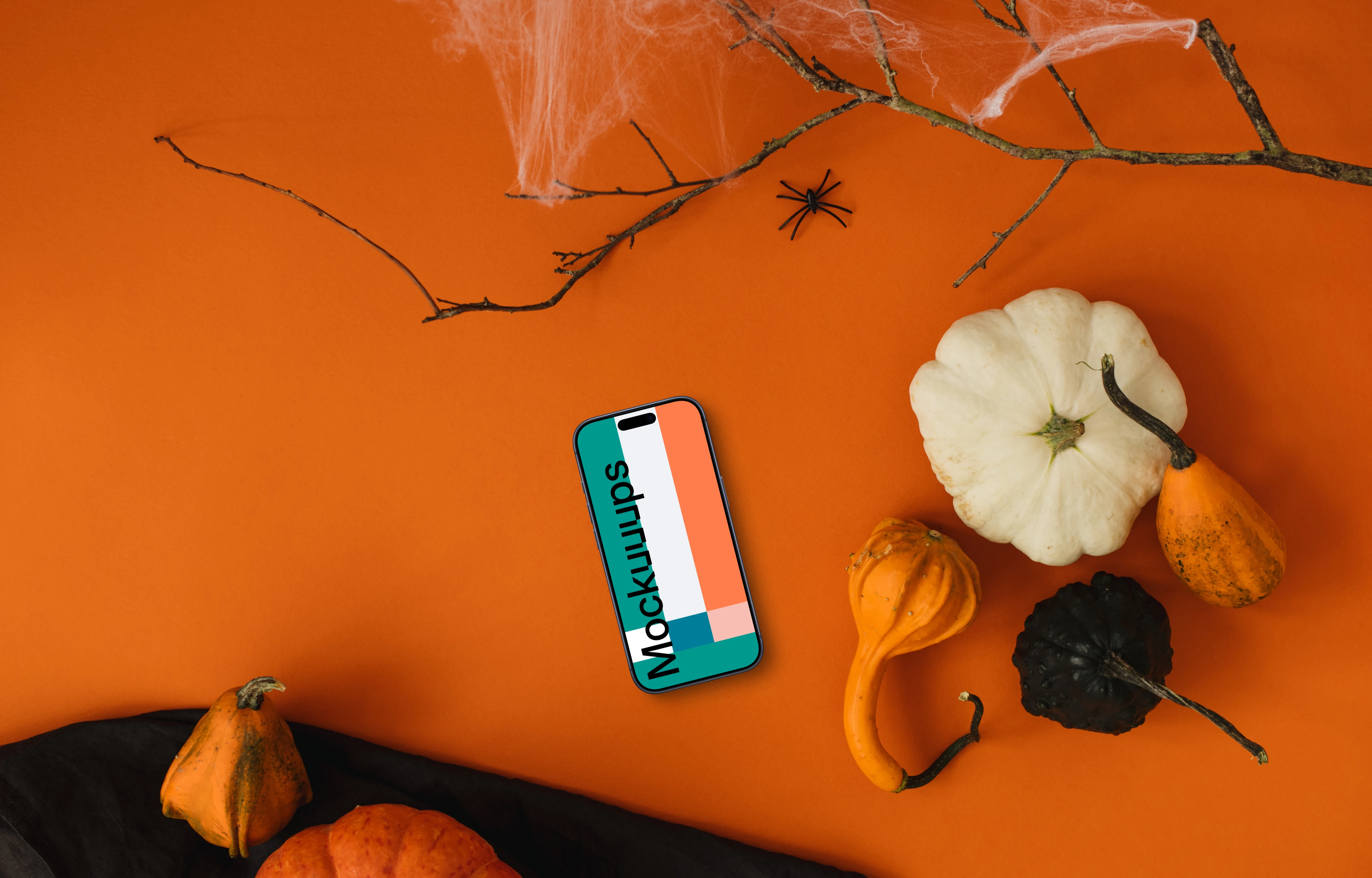 Top view of halloween background mockup with a phone