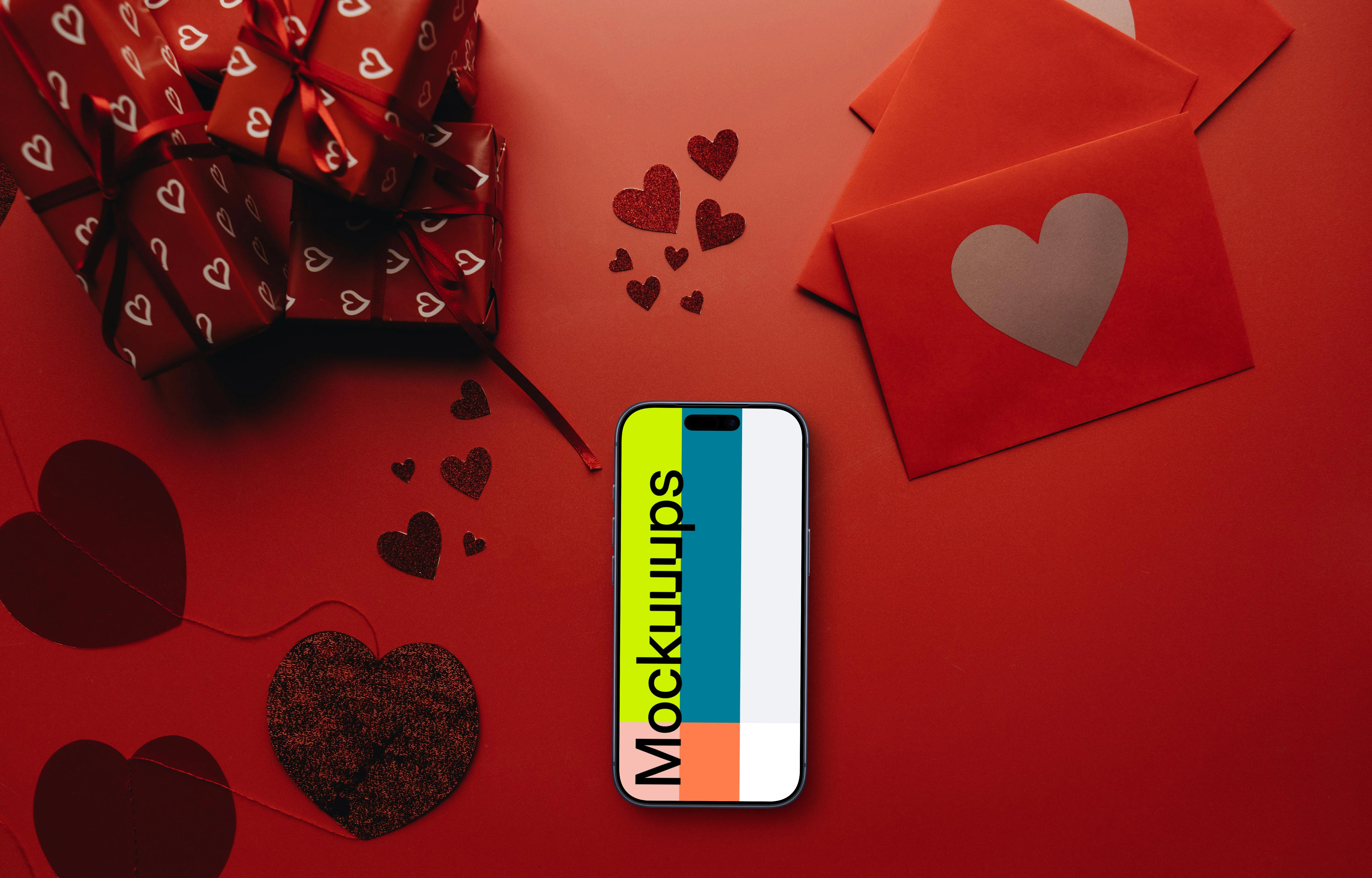Smartphone mockup in a red scene with hearts and gifts