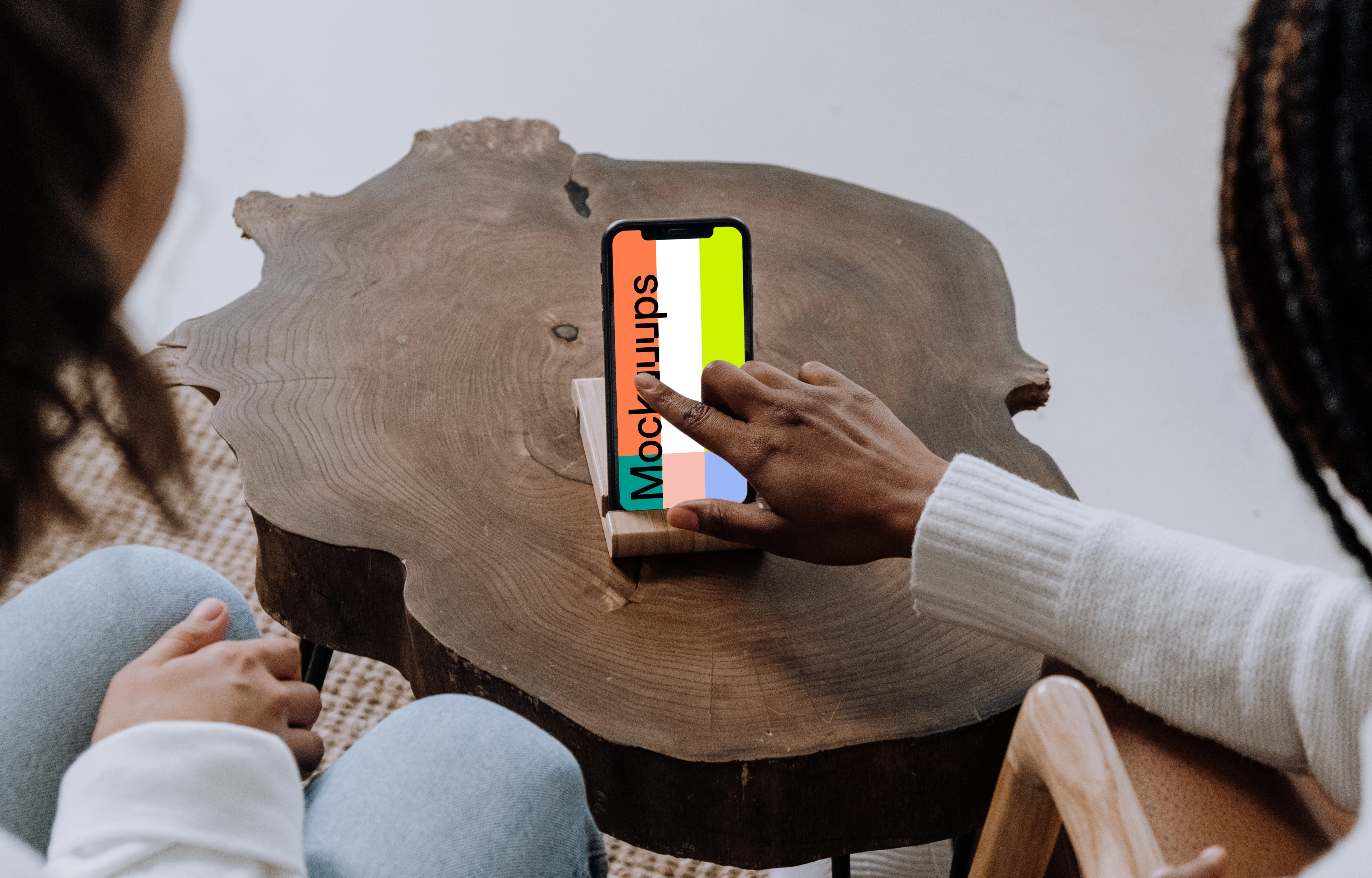 iPhone mockup on wooden center table