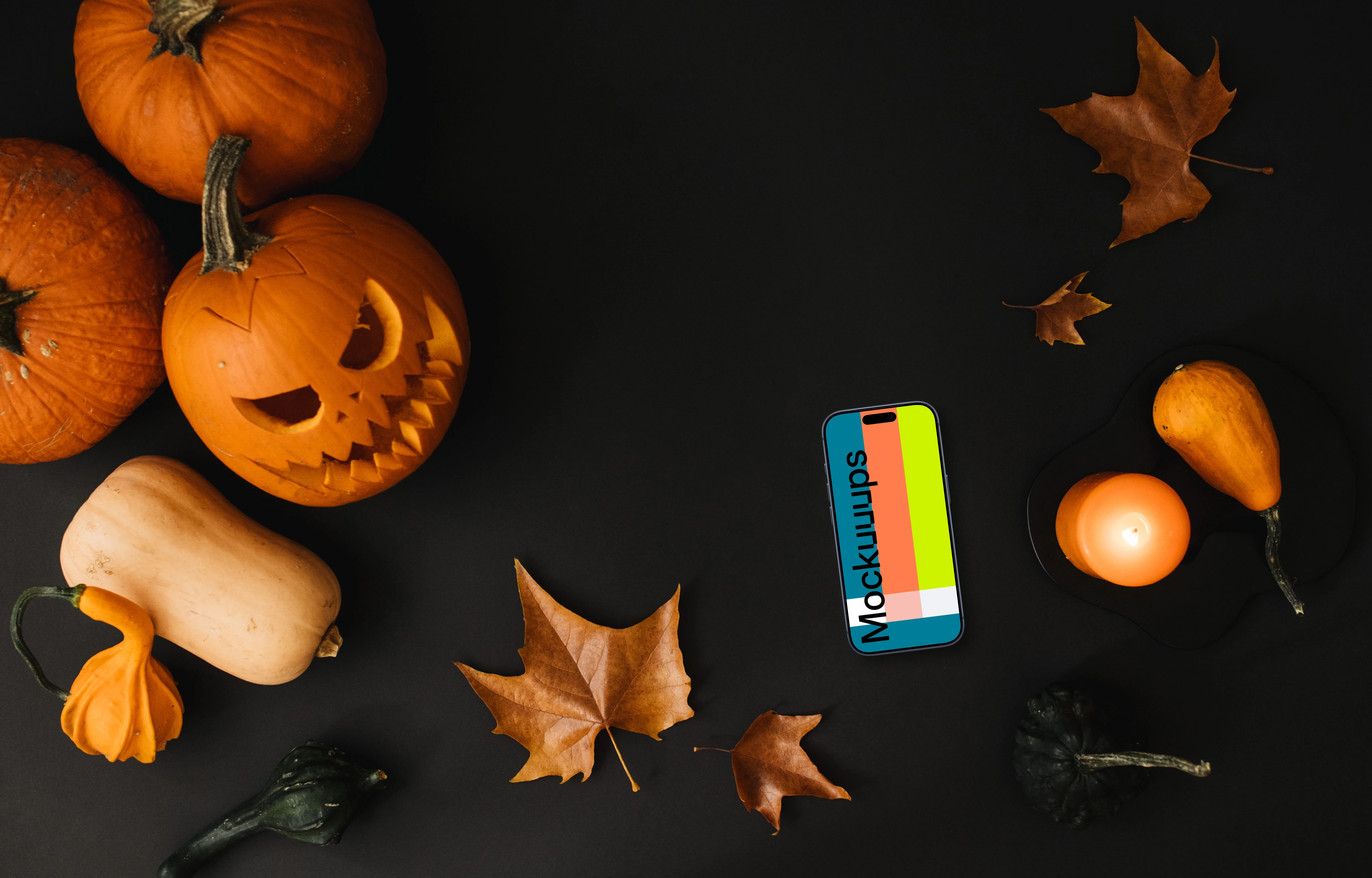 Halloween pumpkin mockup with a phone on the dark background