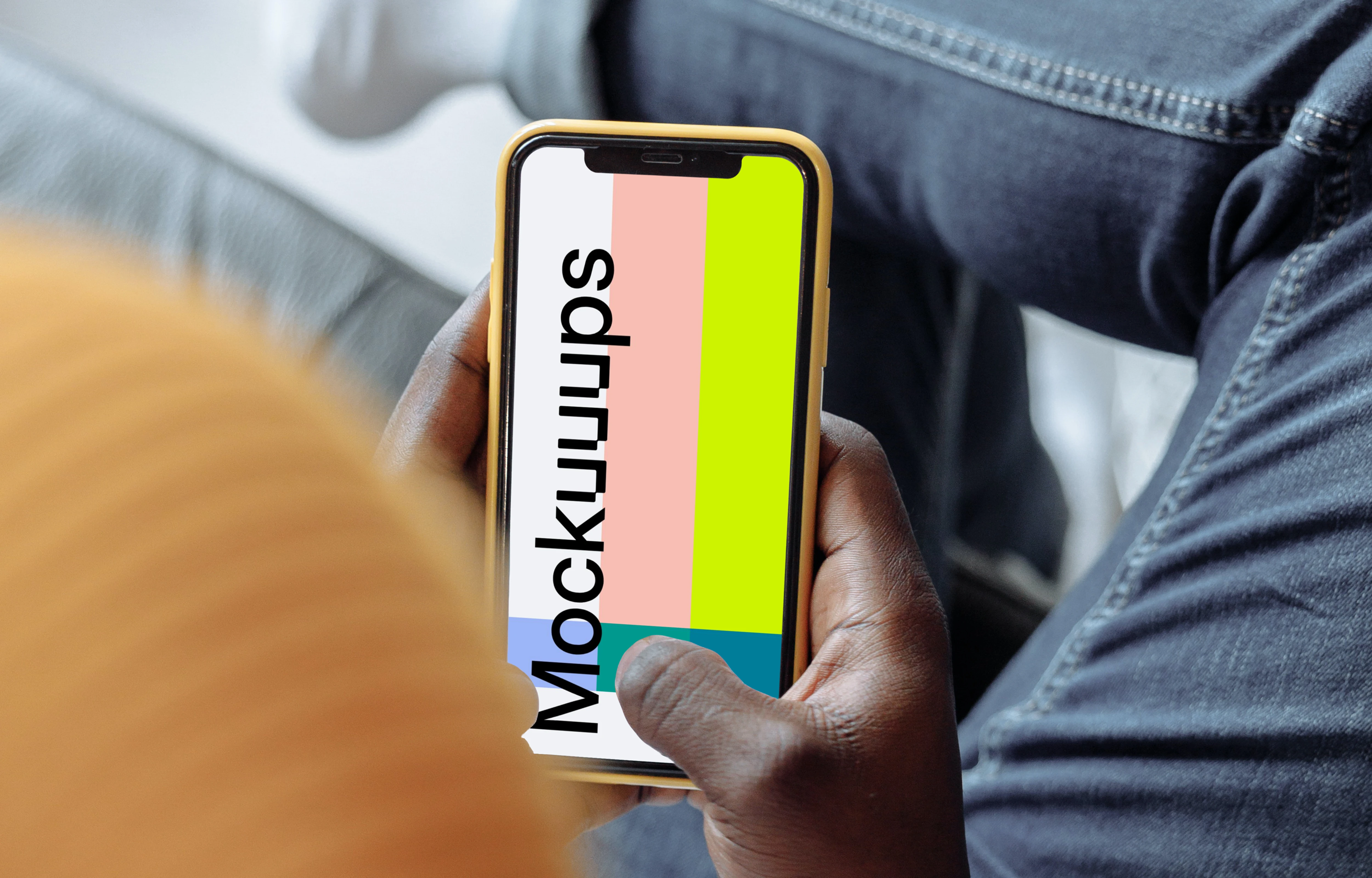 Hand holding iPhone mockup