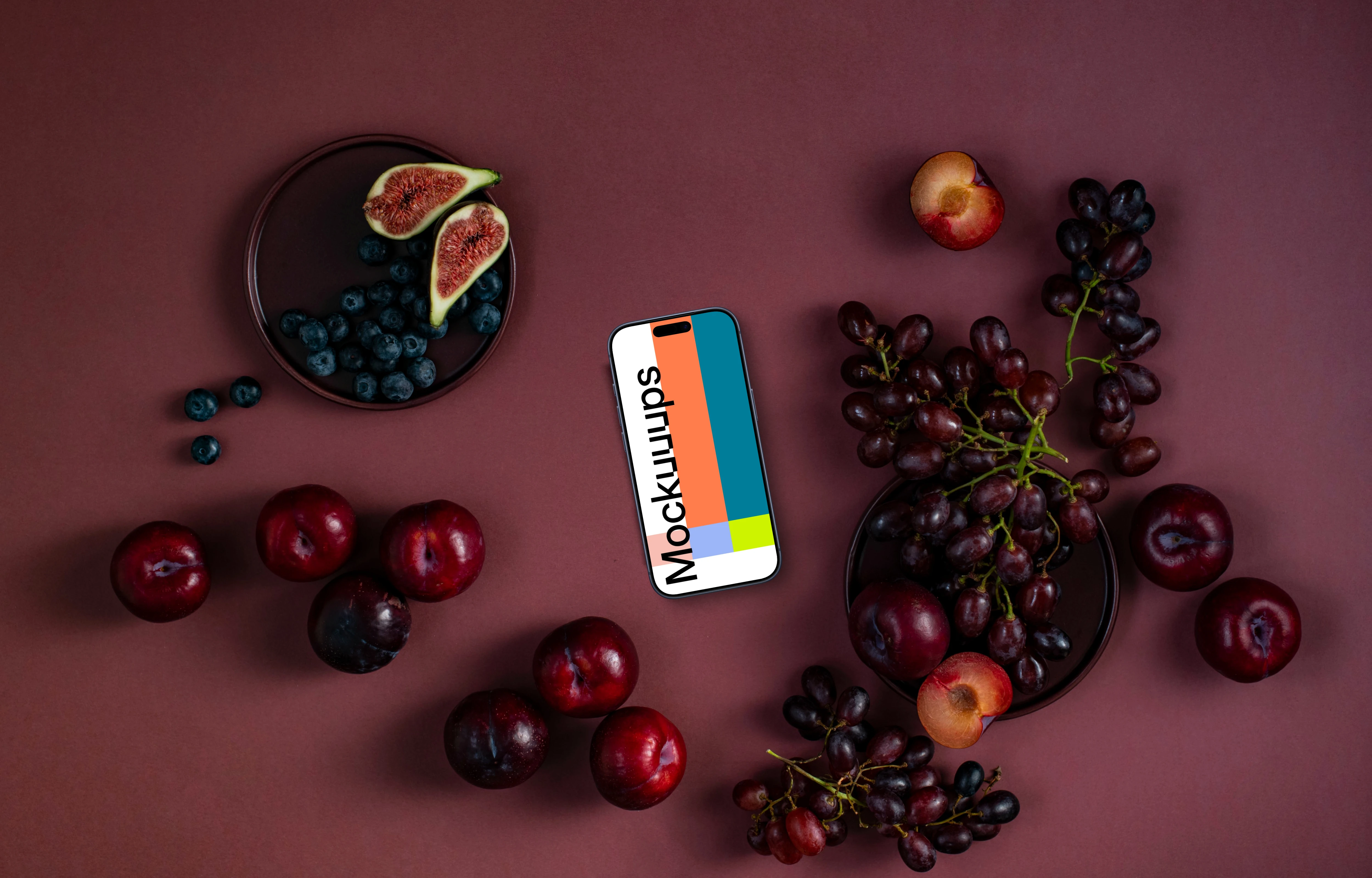 Phone with fruits on the Viva Magenta background
