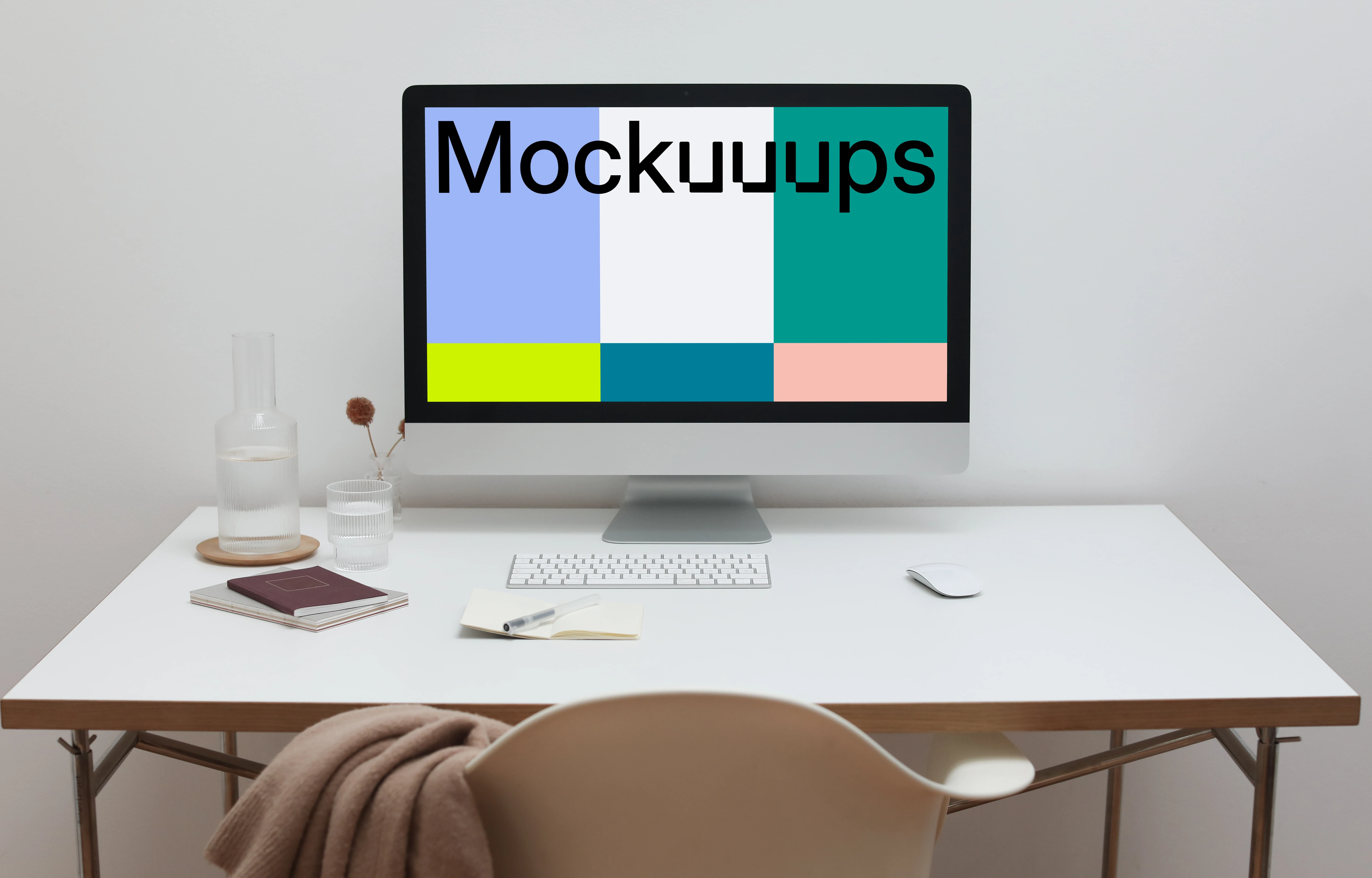 iMac mockup on a table with a jacket hanging on a chair in front of it