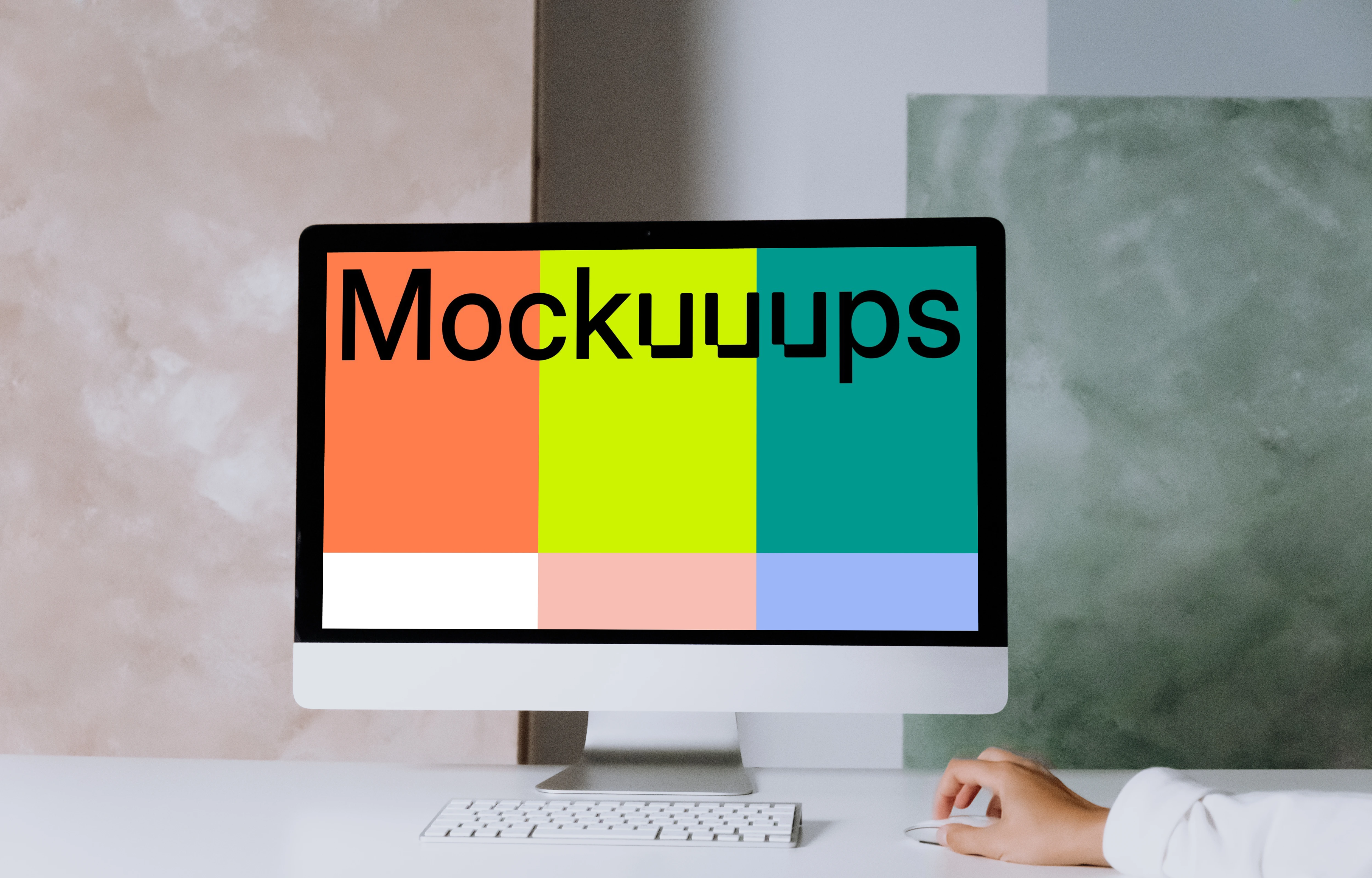 iMac mockup on a table with green and pink background