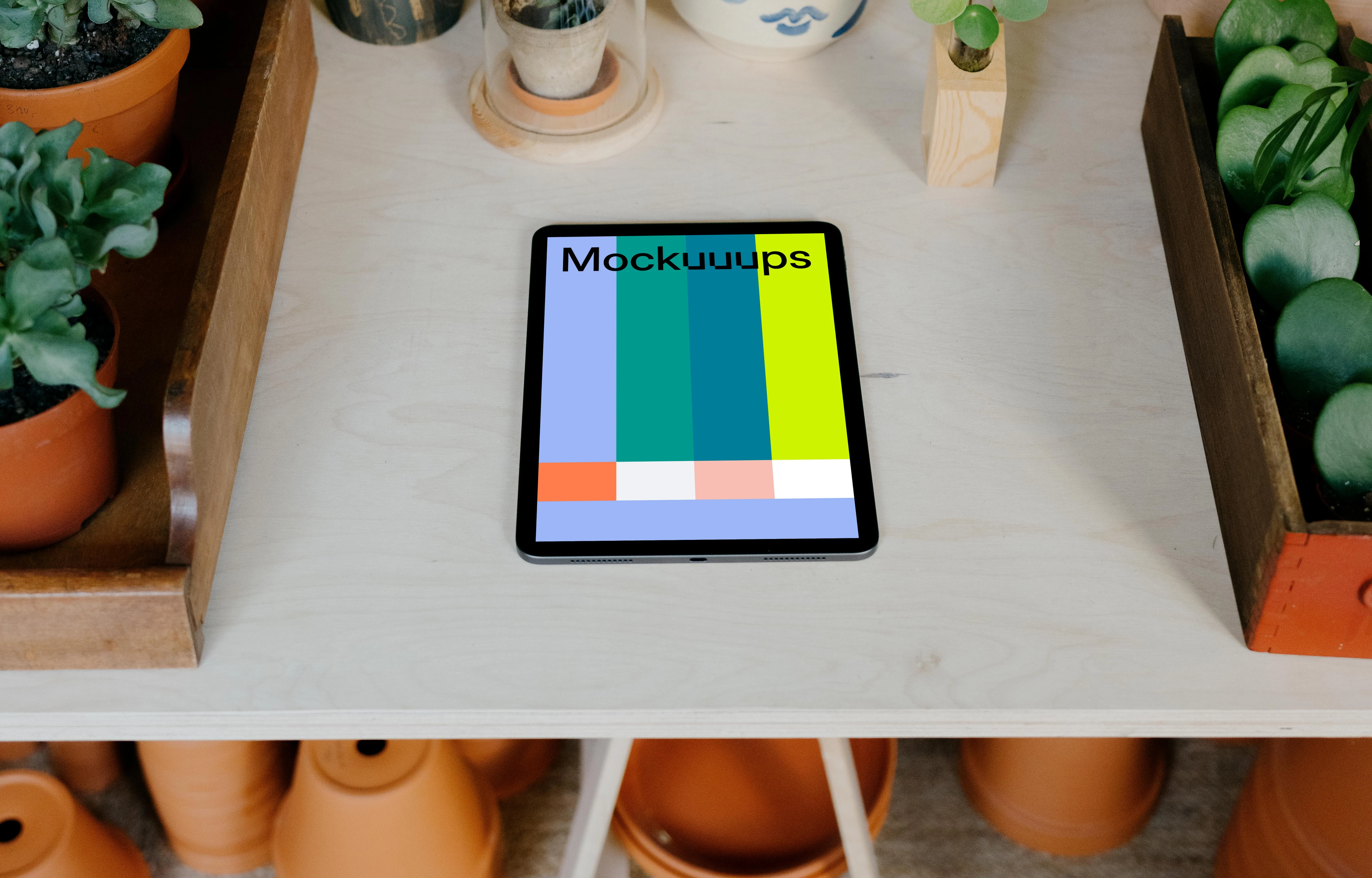iPad mockup on a white garden table