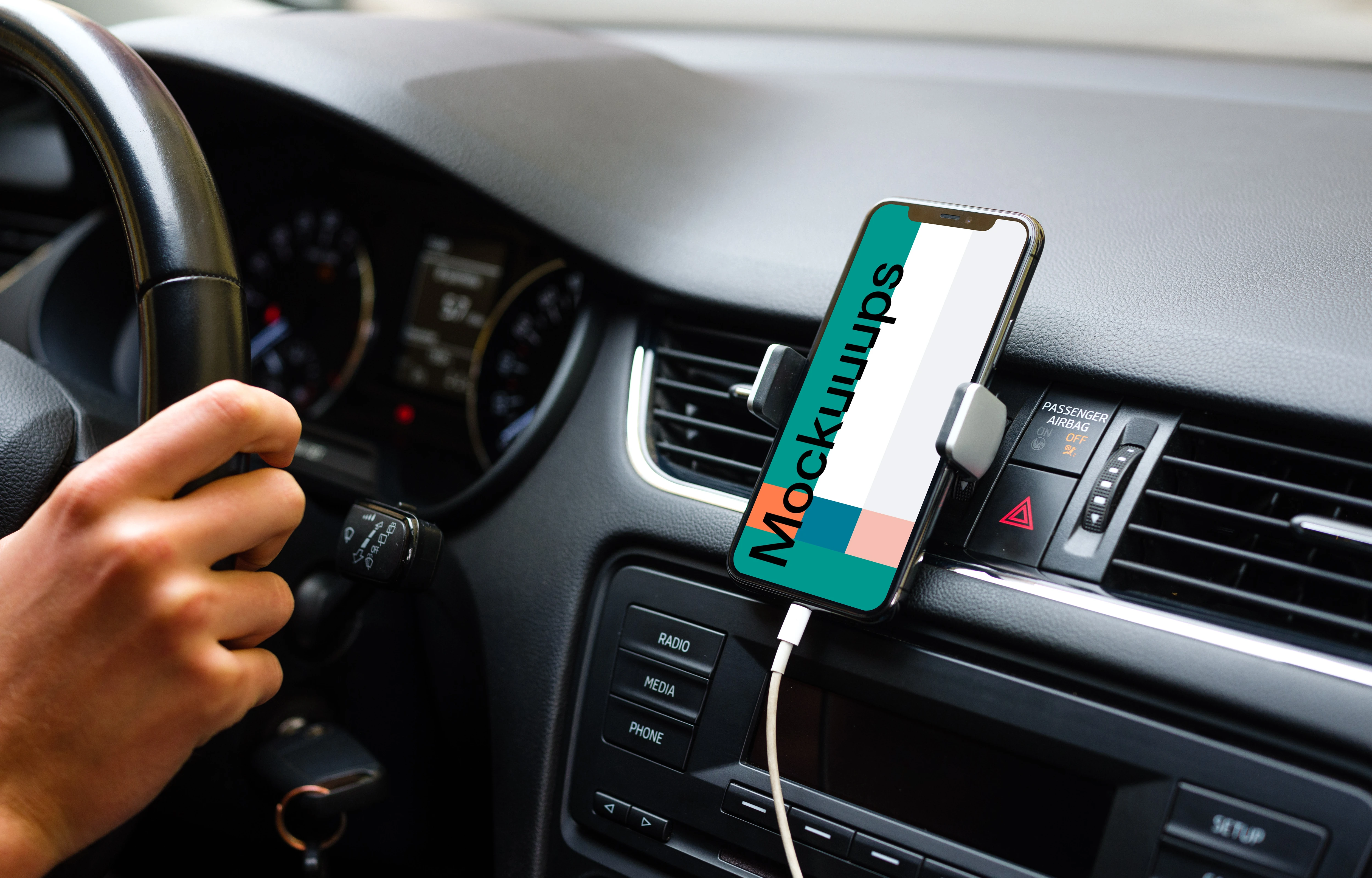 iPhone 11 mockup mounted on car dashboard with driver