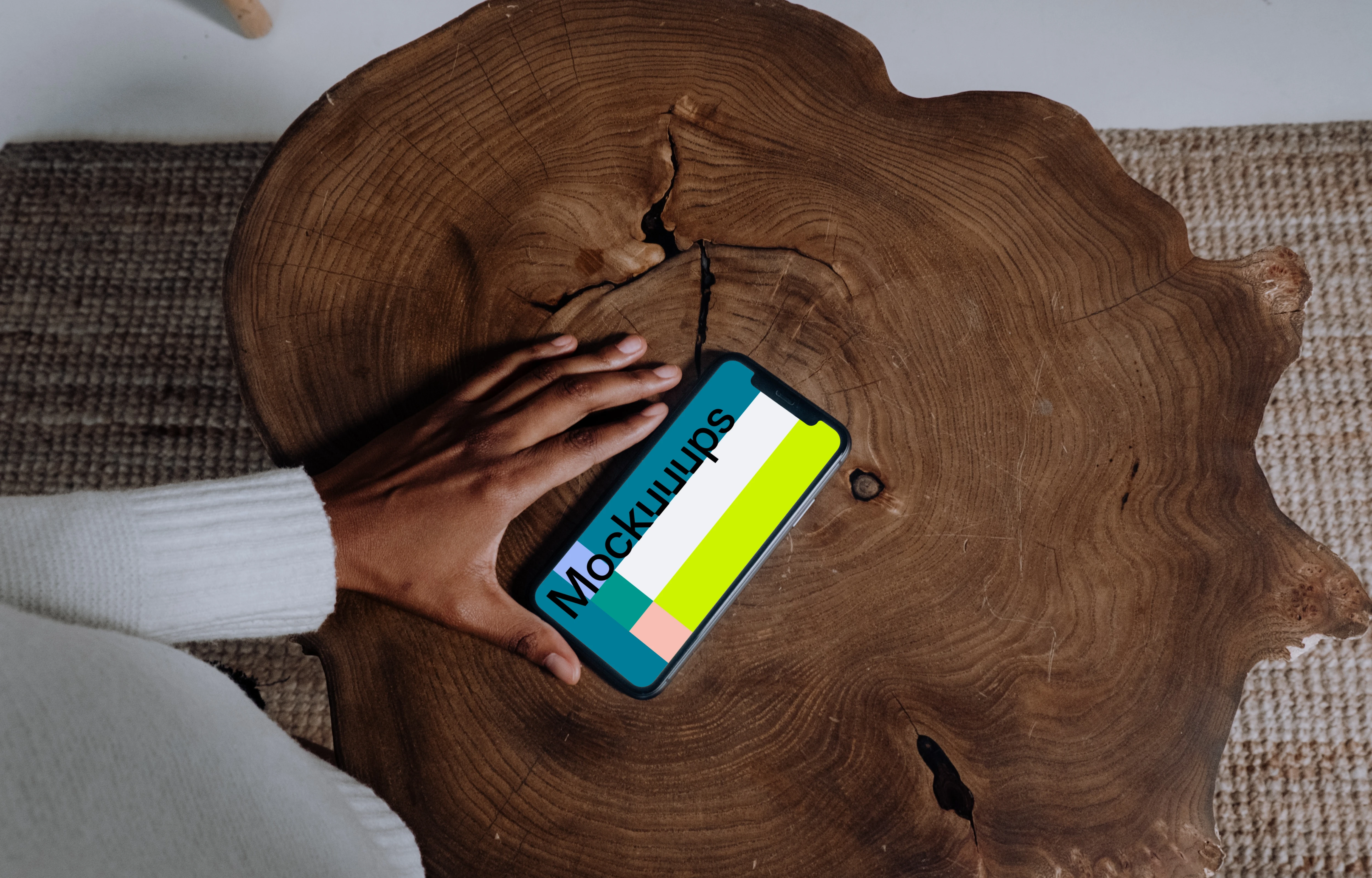 iPhone mockup on a wooden table