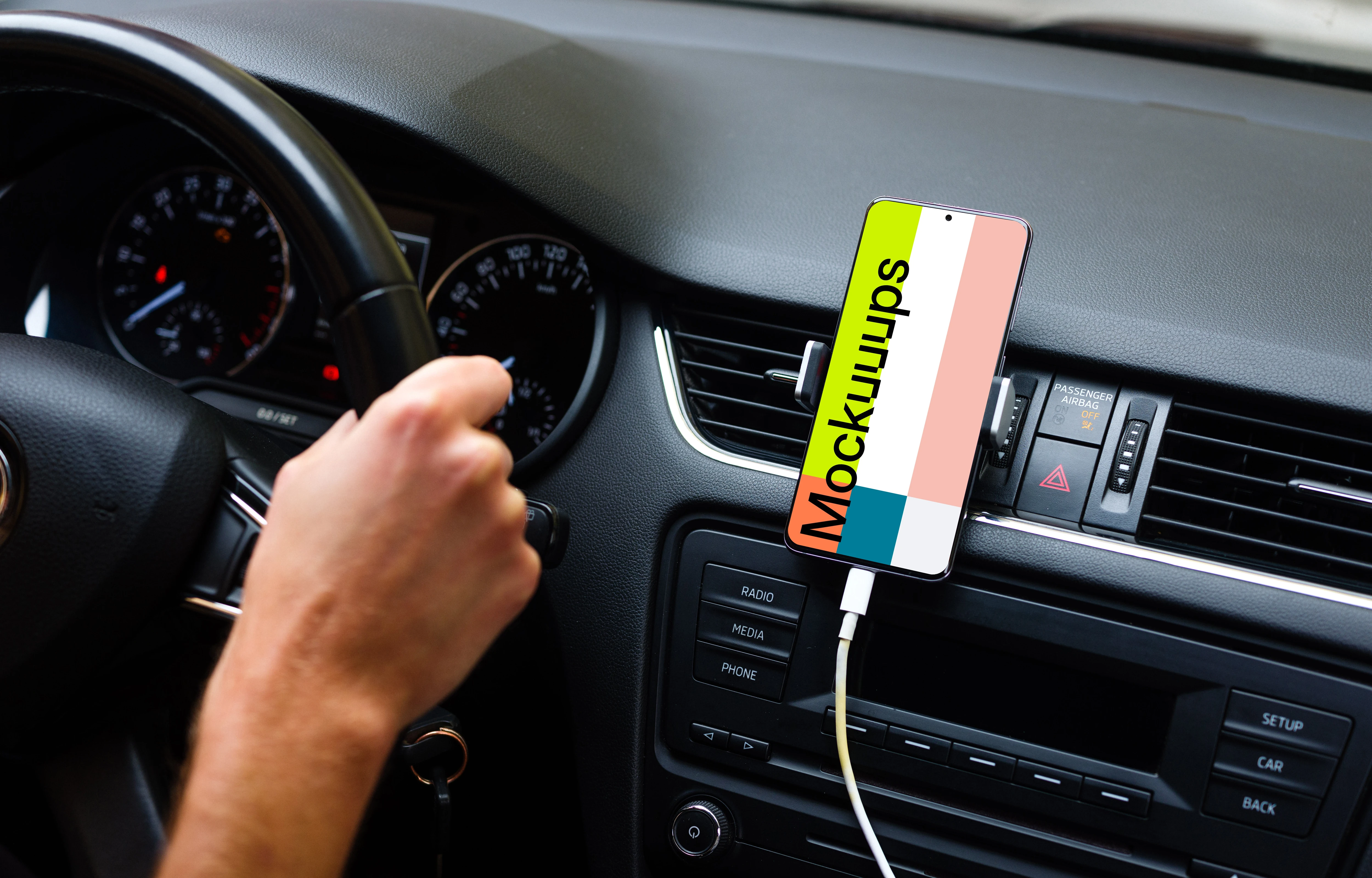 Driver using Samsung S20 mockup mounted while driving