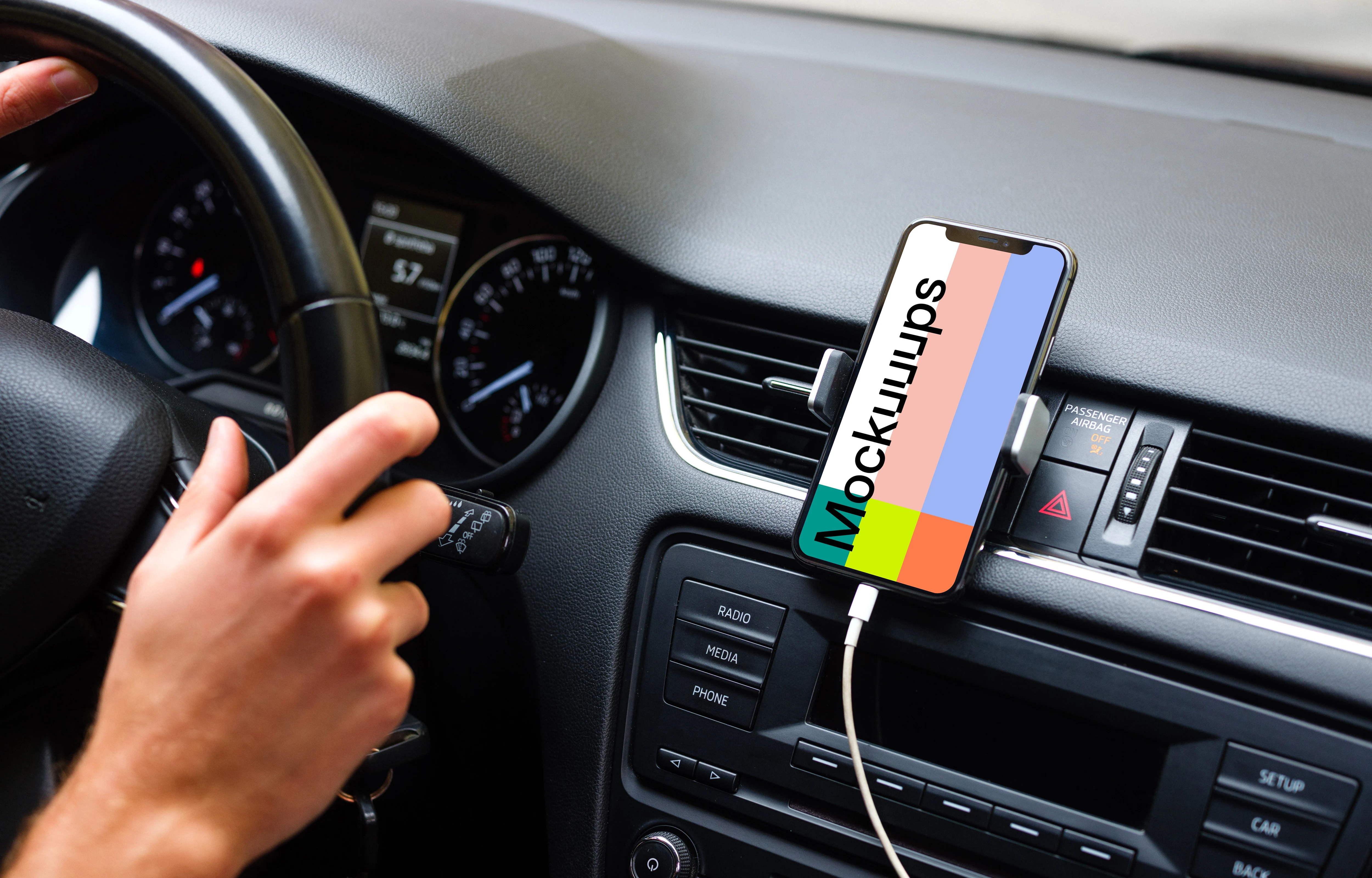 iPhone 11 mockup mounted next to car driver for navigation