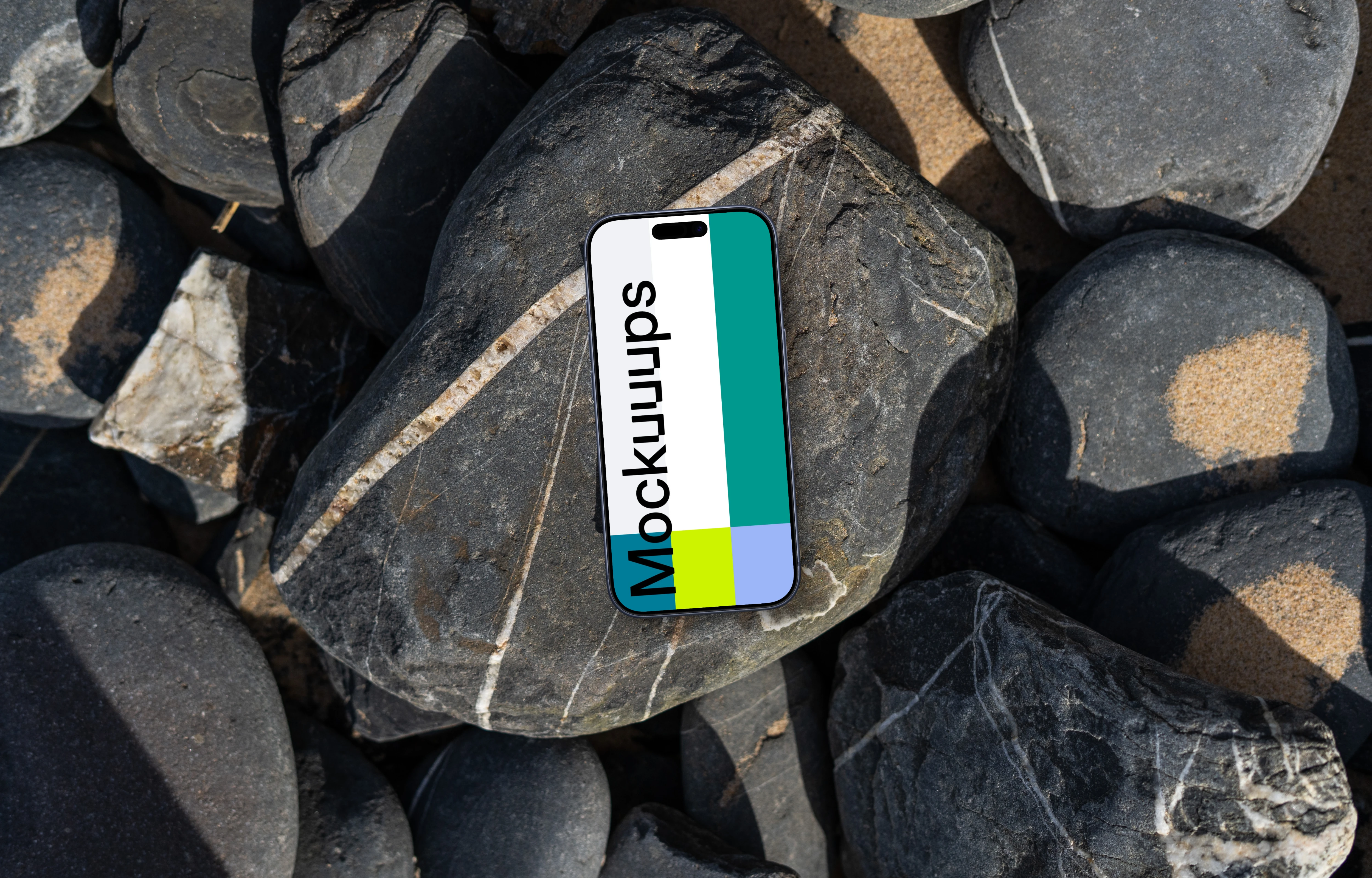 Smartphone mockup laying on a pile of rocks