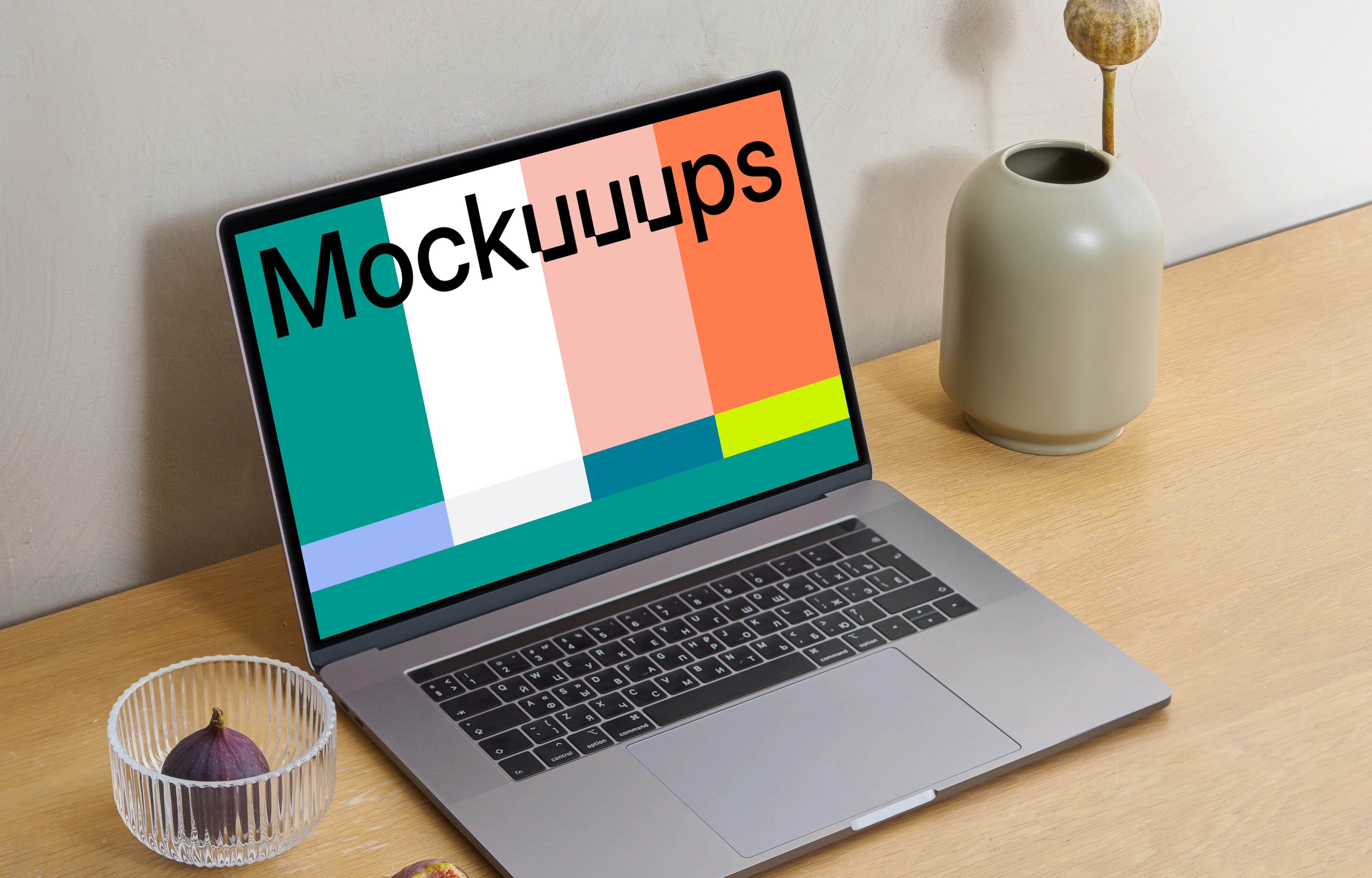 MacBook mockup on a wooden workstation table