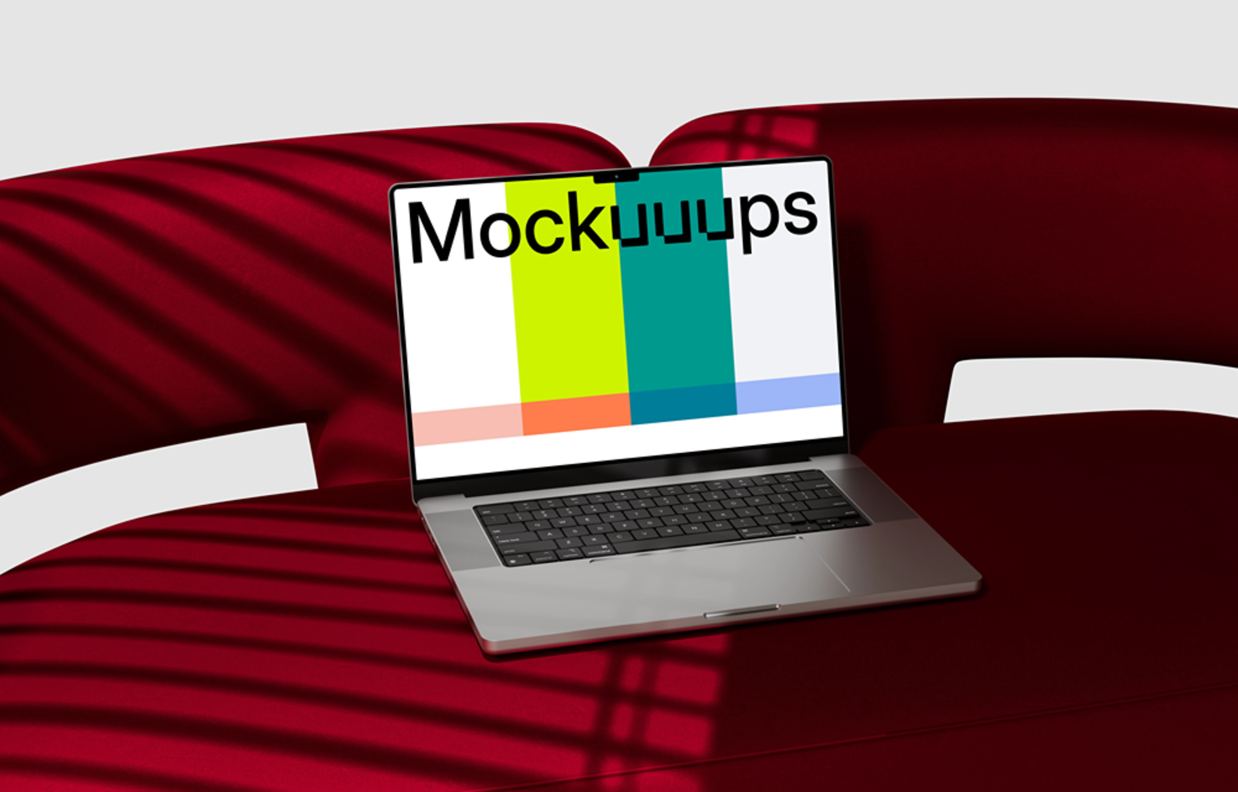 MacBook Pro mockup on a red curved sofa