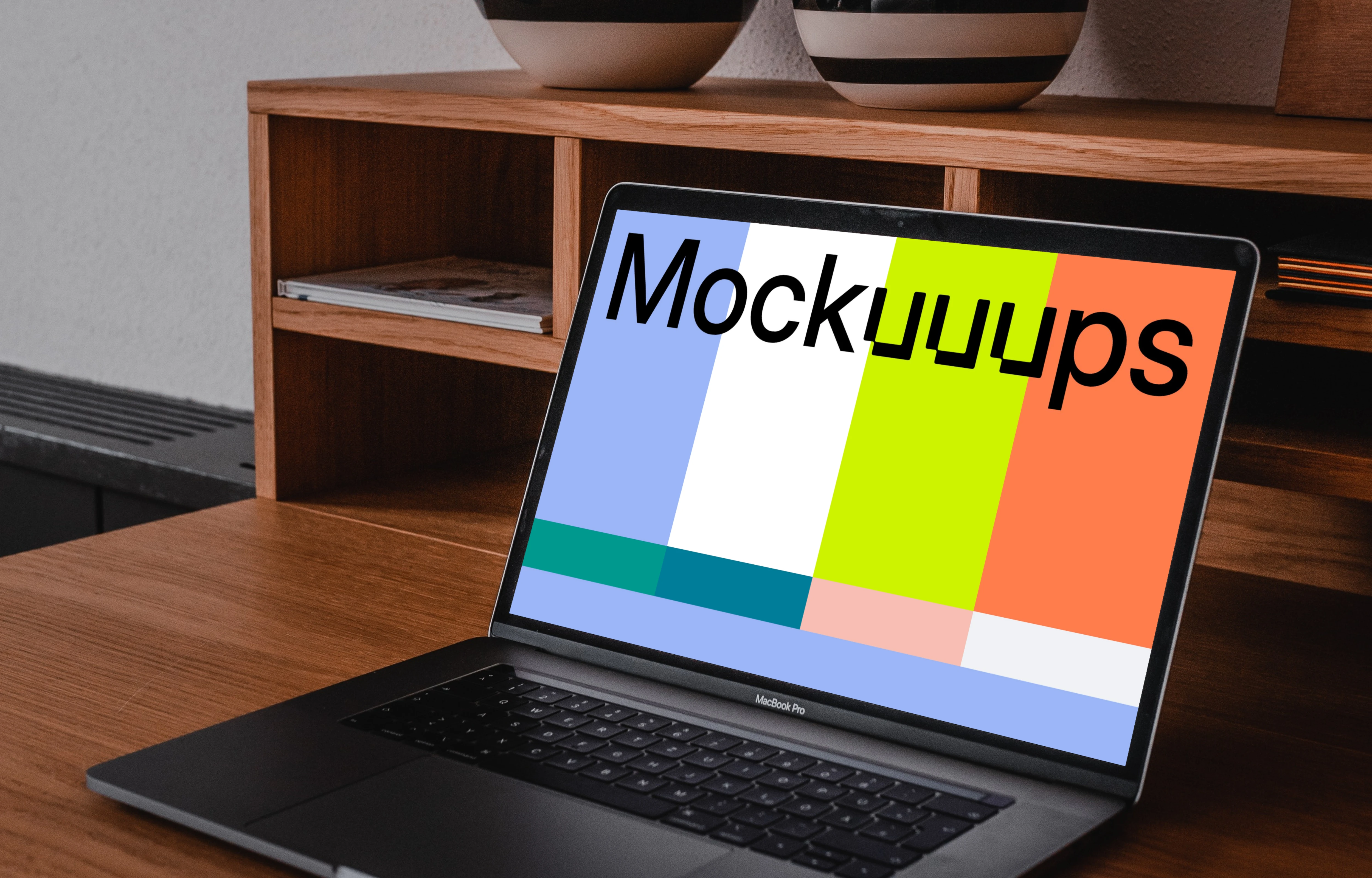 MacBook Pro mockup on a table with pottery above it