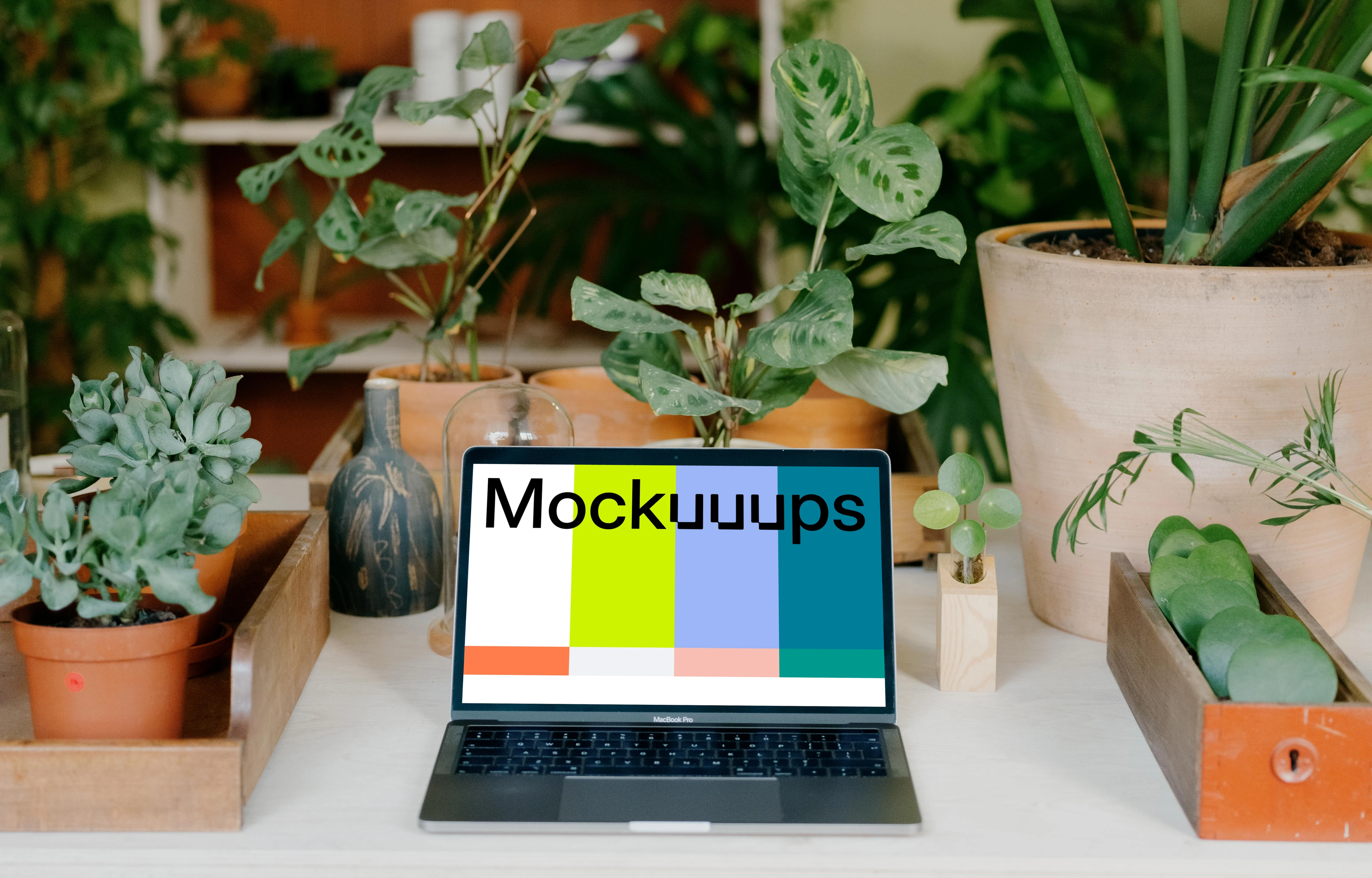 MacBook Pro Mockup on a white garden table.