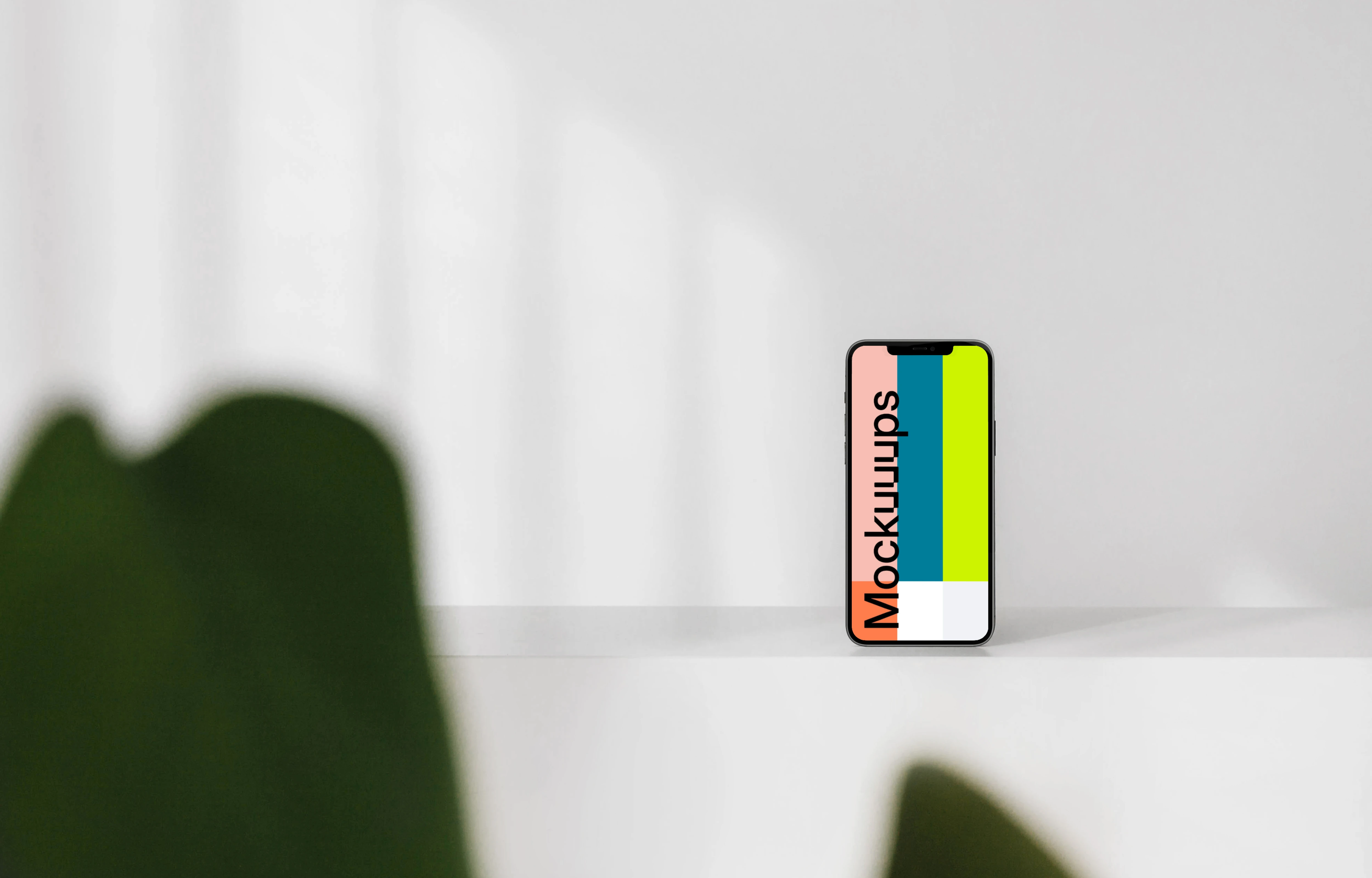 Minimal iPhone mockup on a white wall 