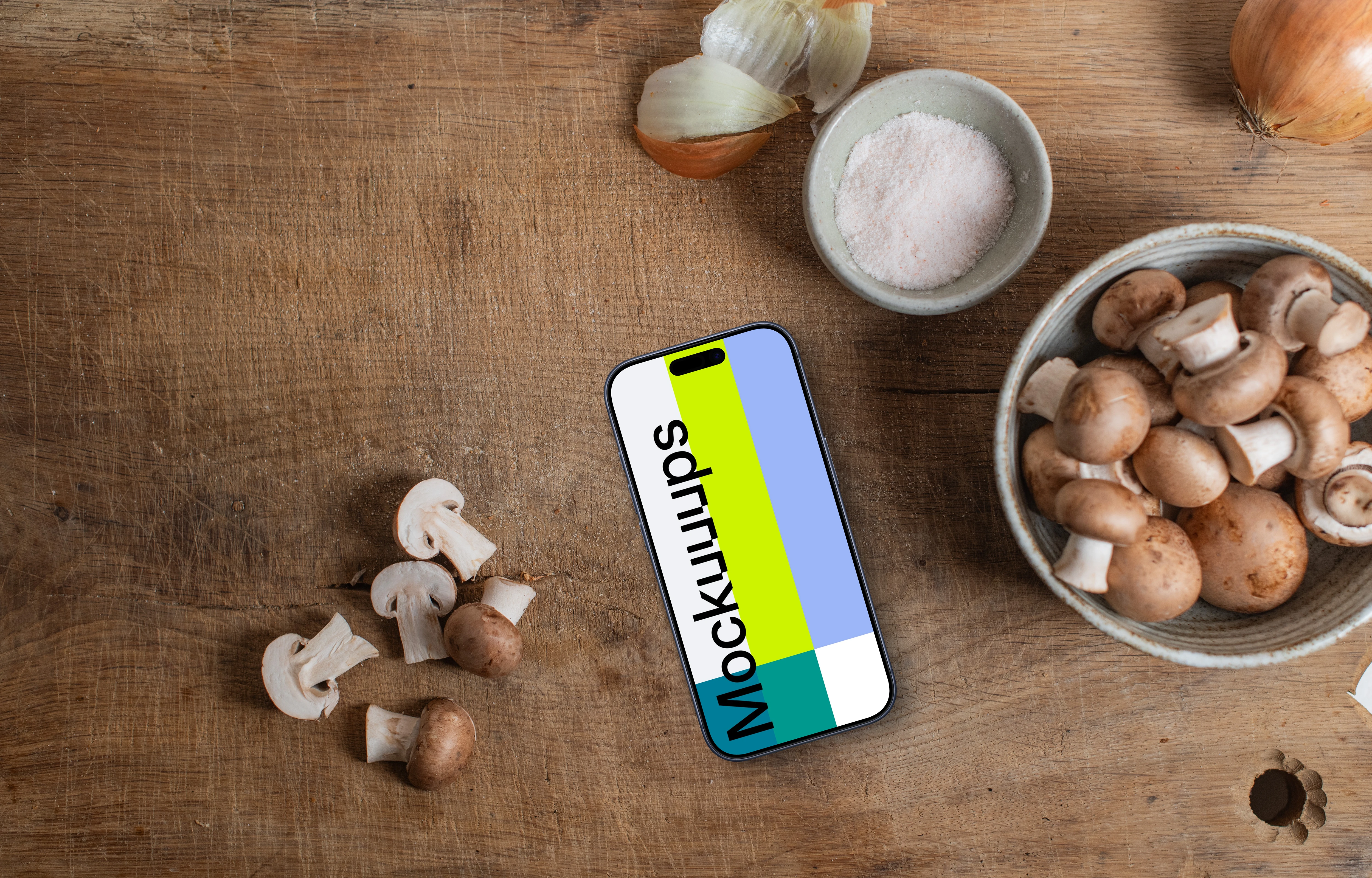 Mushrooms with a iPhone mockup on sideboard