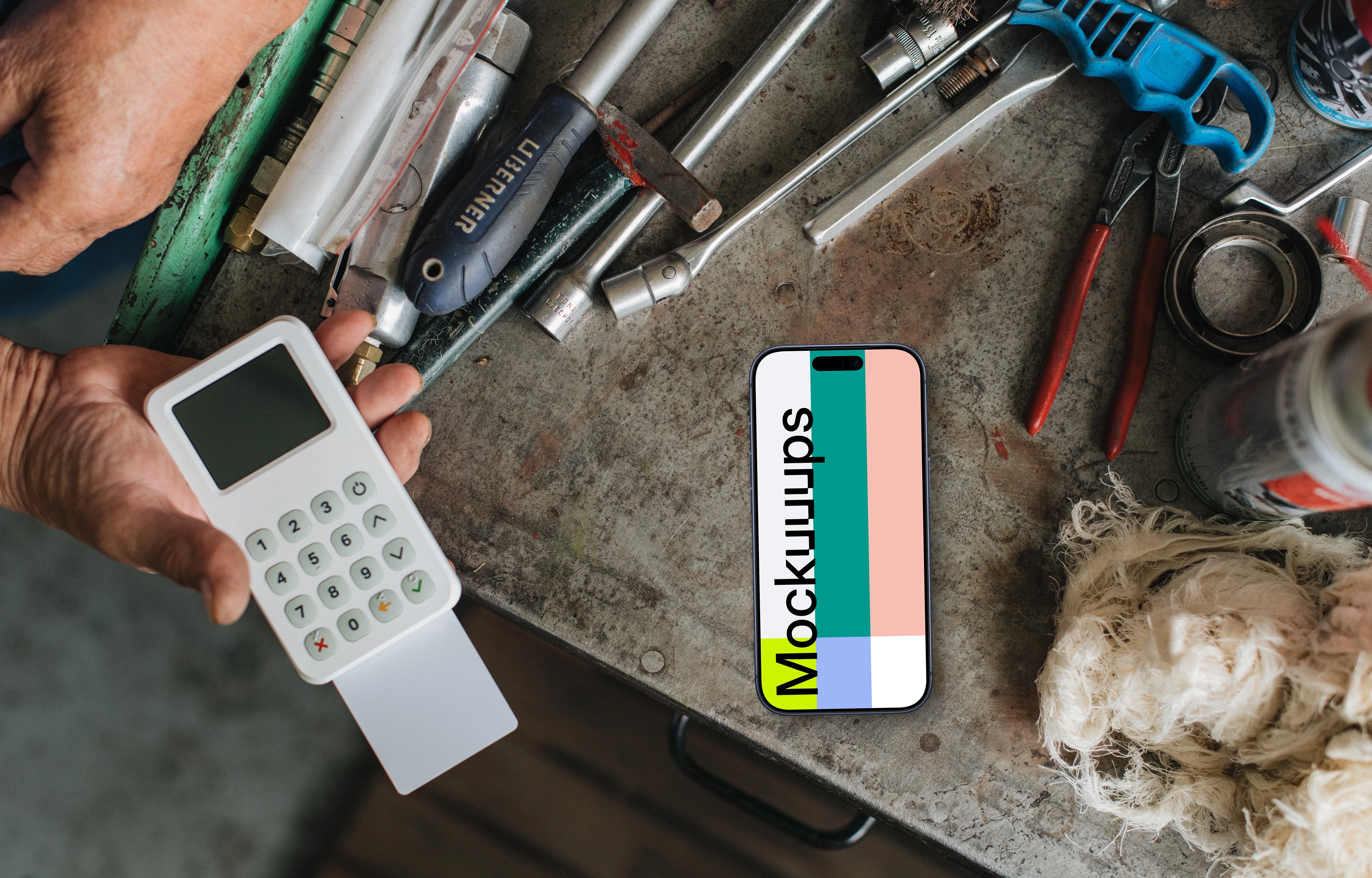 Payment terminal with an iPhone mockup in the workshop
