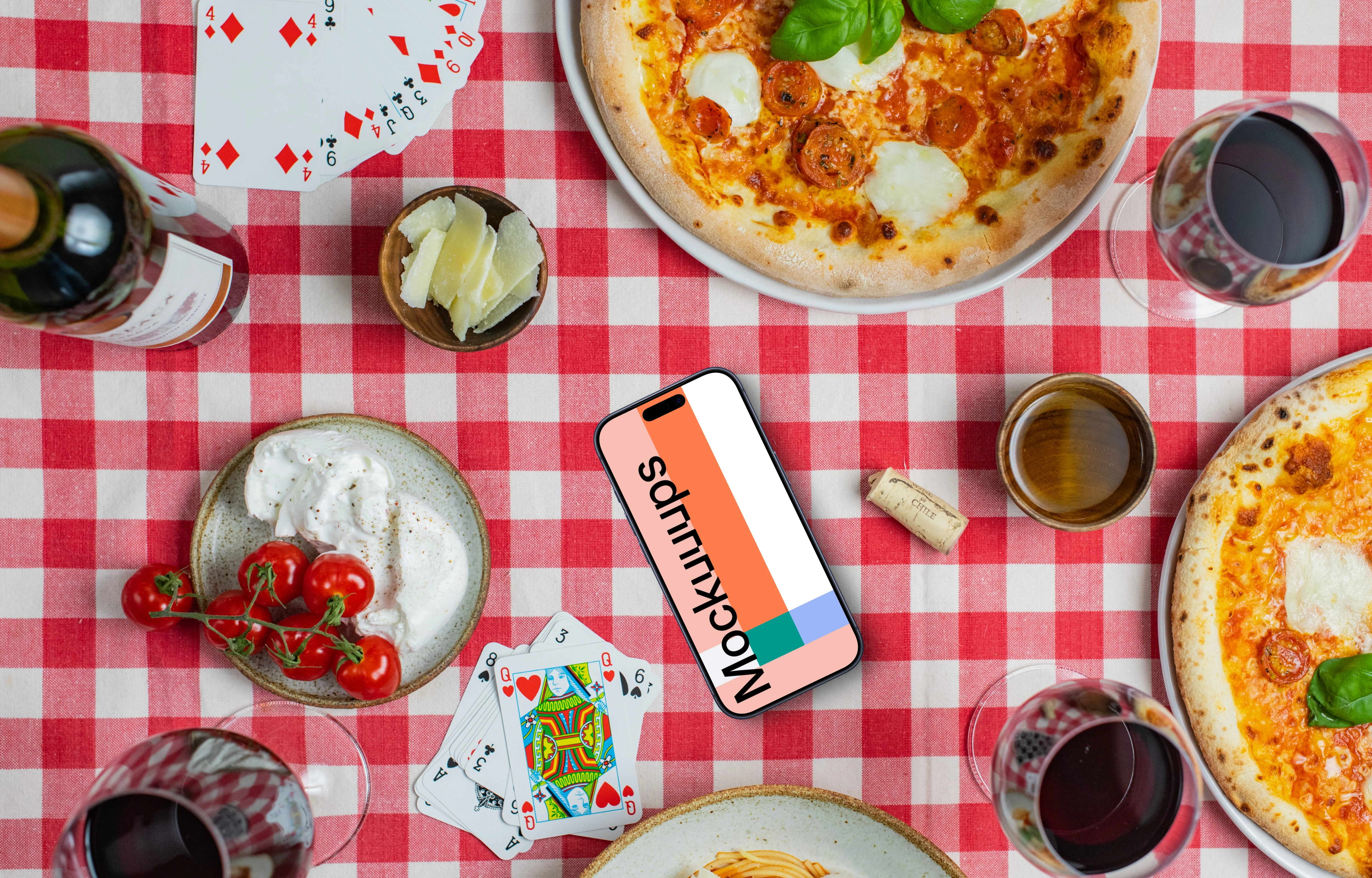 Phone mockup on checkered tablecloth with pizzas