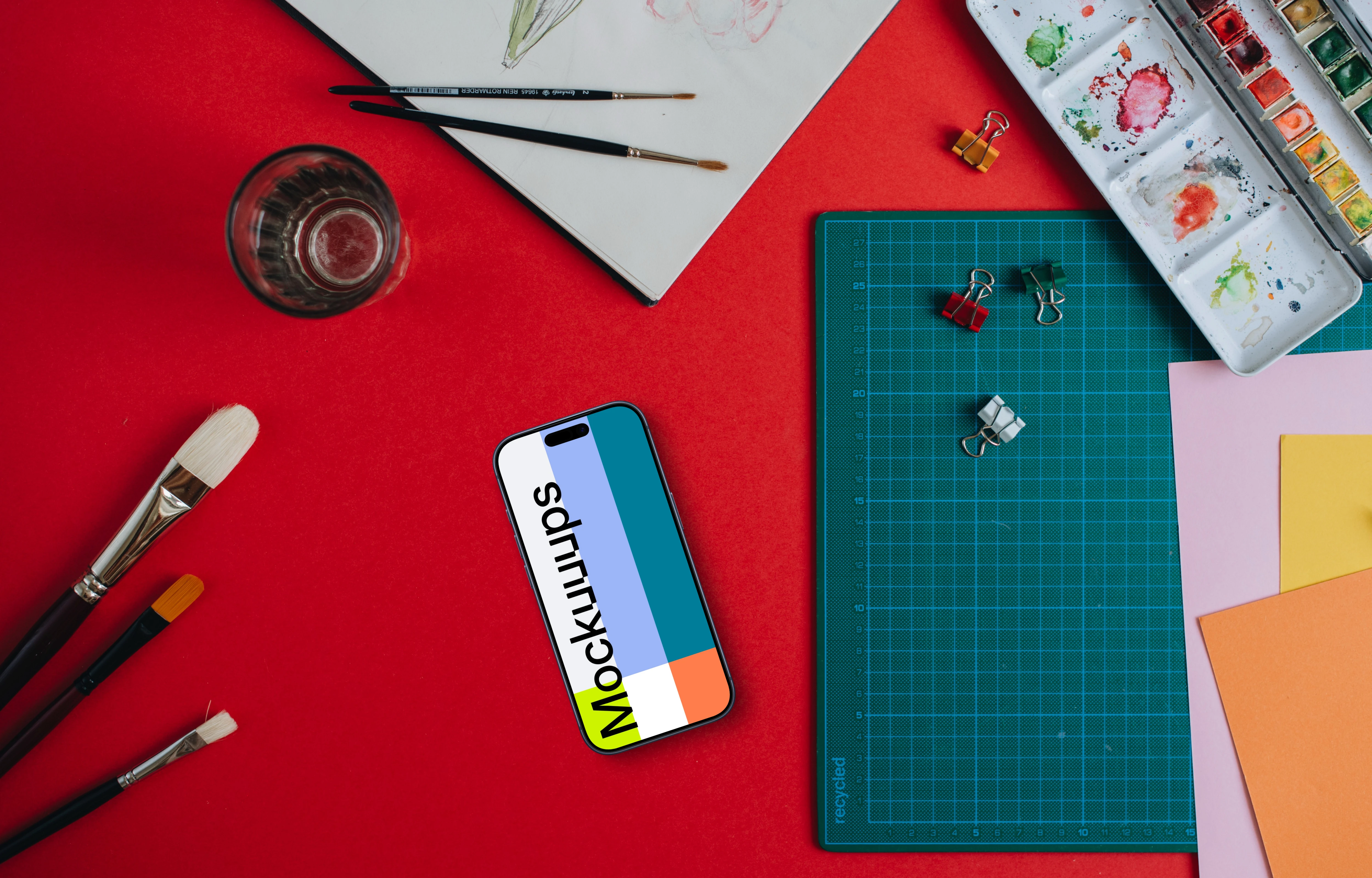 Phone mockup with painting accessories around