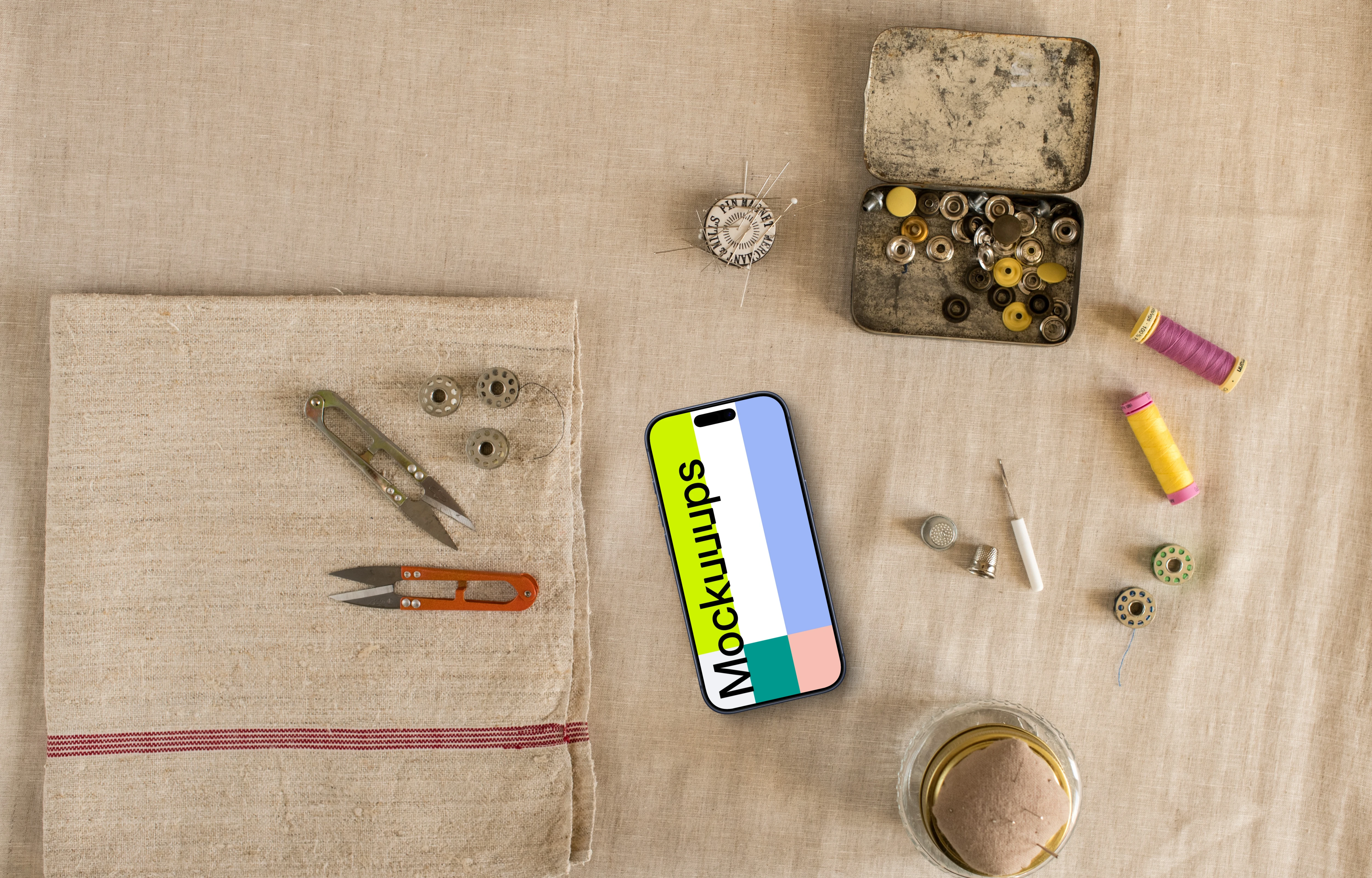 Phone mockup with sewing accessories