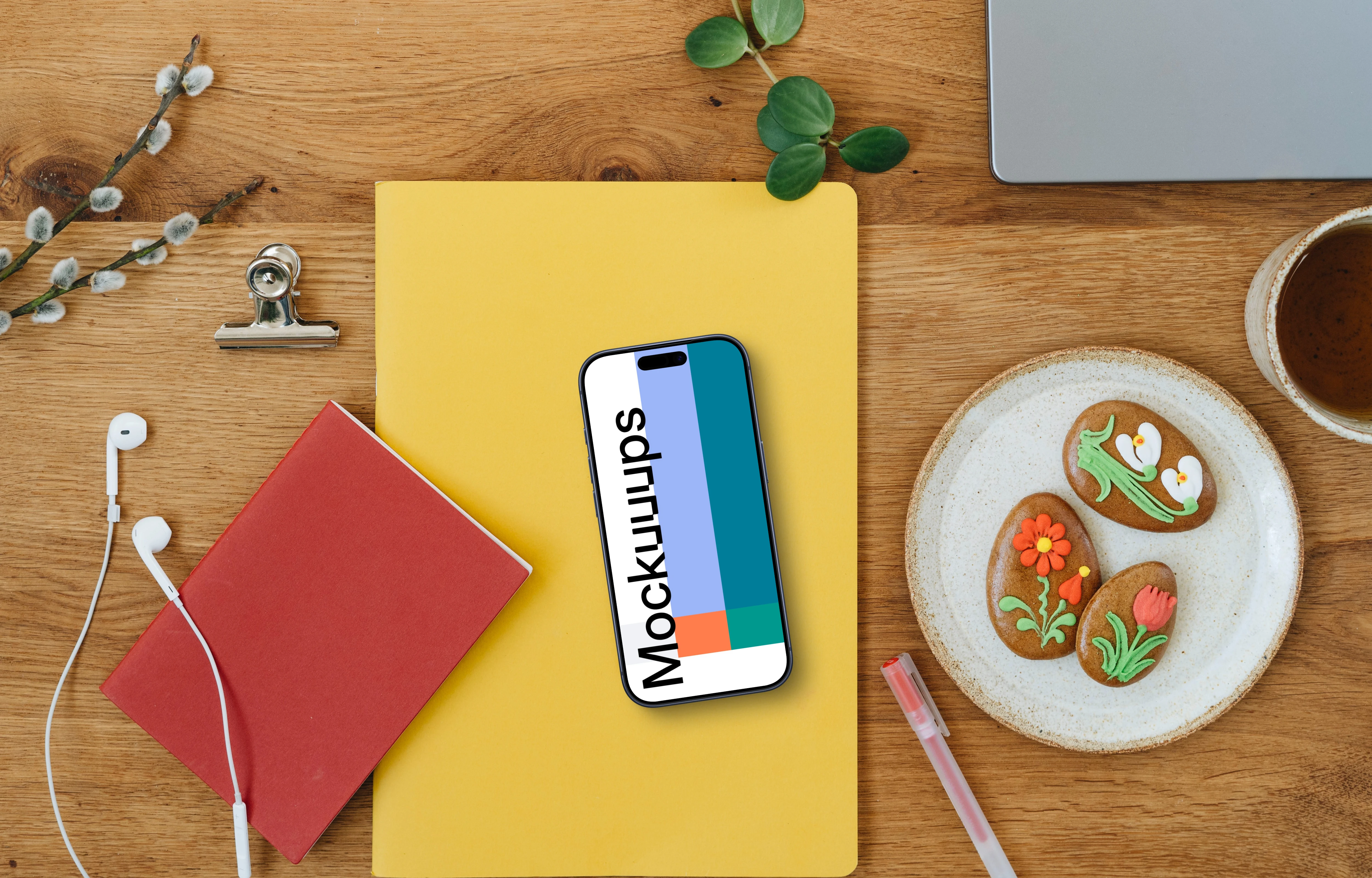 Smartphone mockup on a yellow notebook in an Easter settings