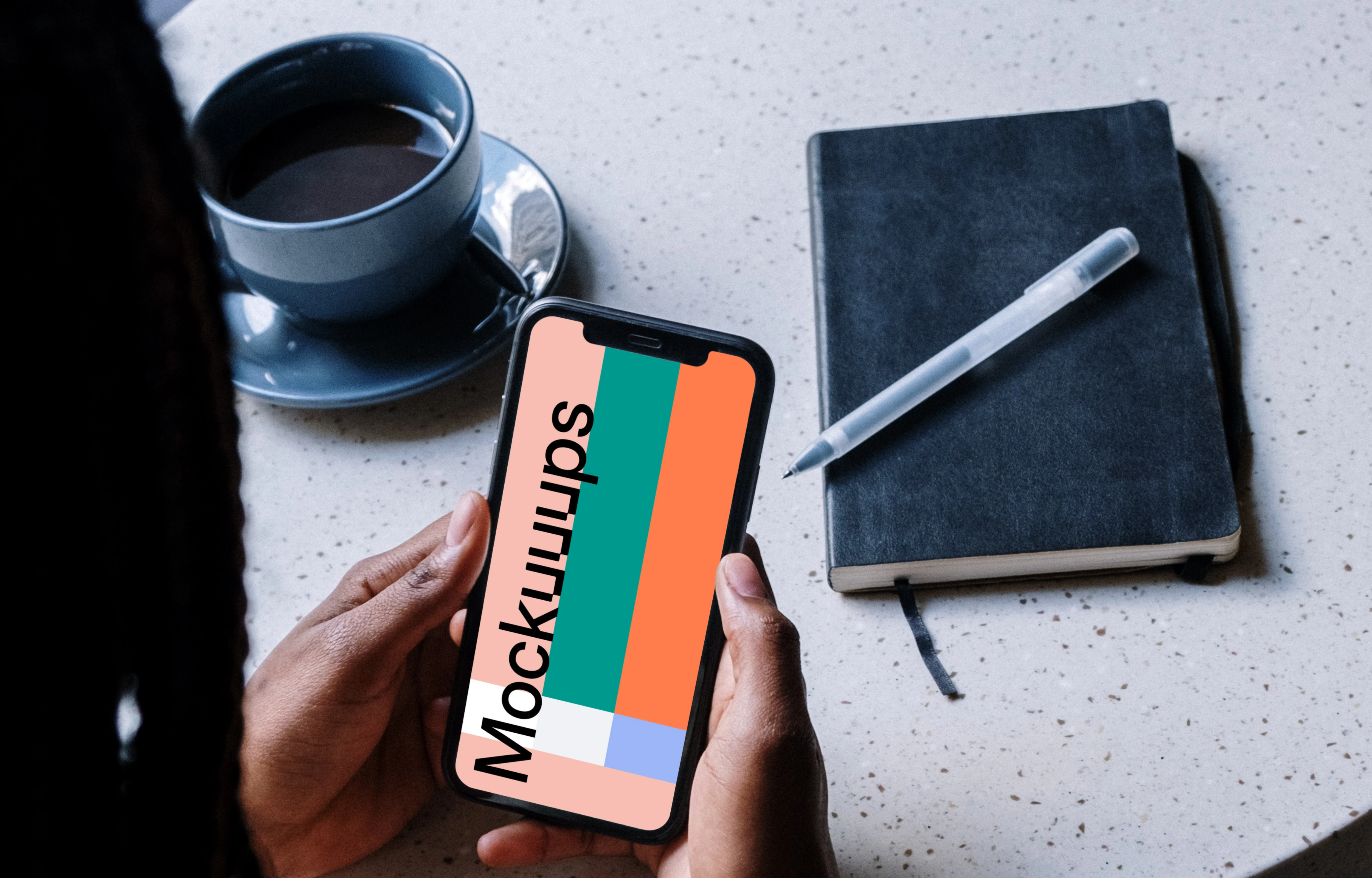 iPhone mockup in a ladies hand with a cup of coffee by the side