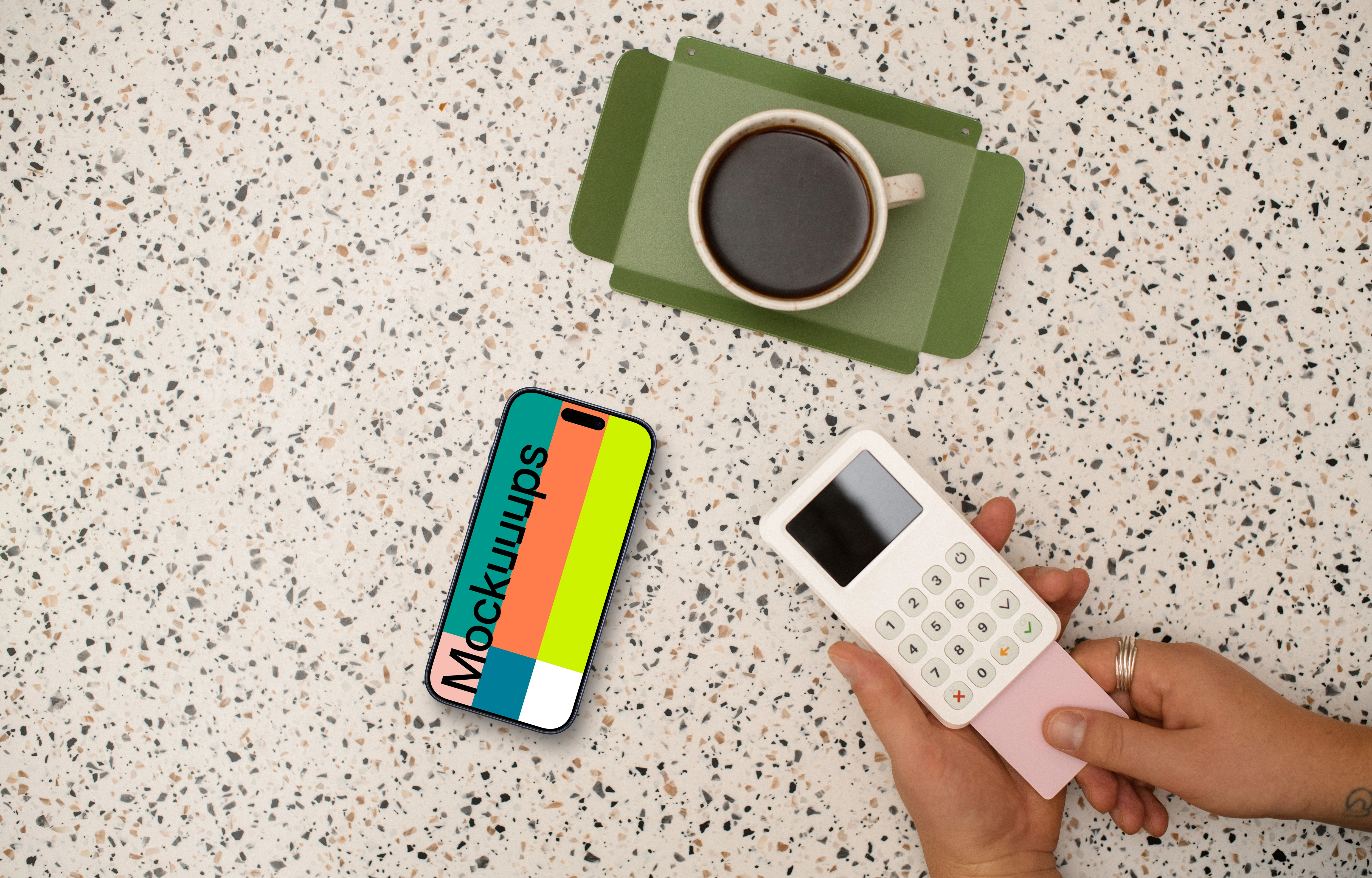 Showcase of coffee shop with an iPhone and credit card terminal