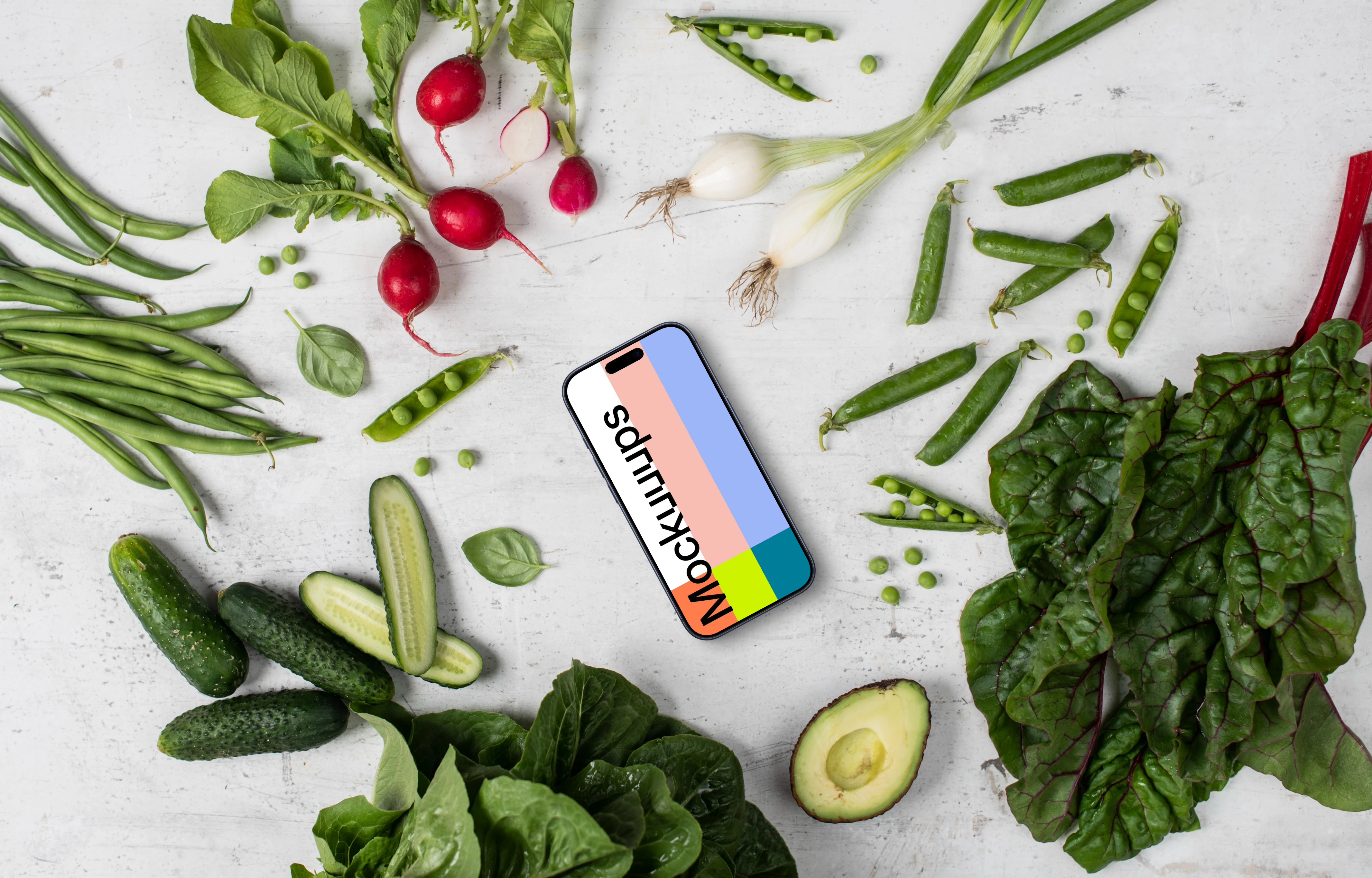 Smartphone mockup in the middle of vegetables