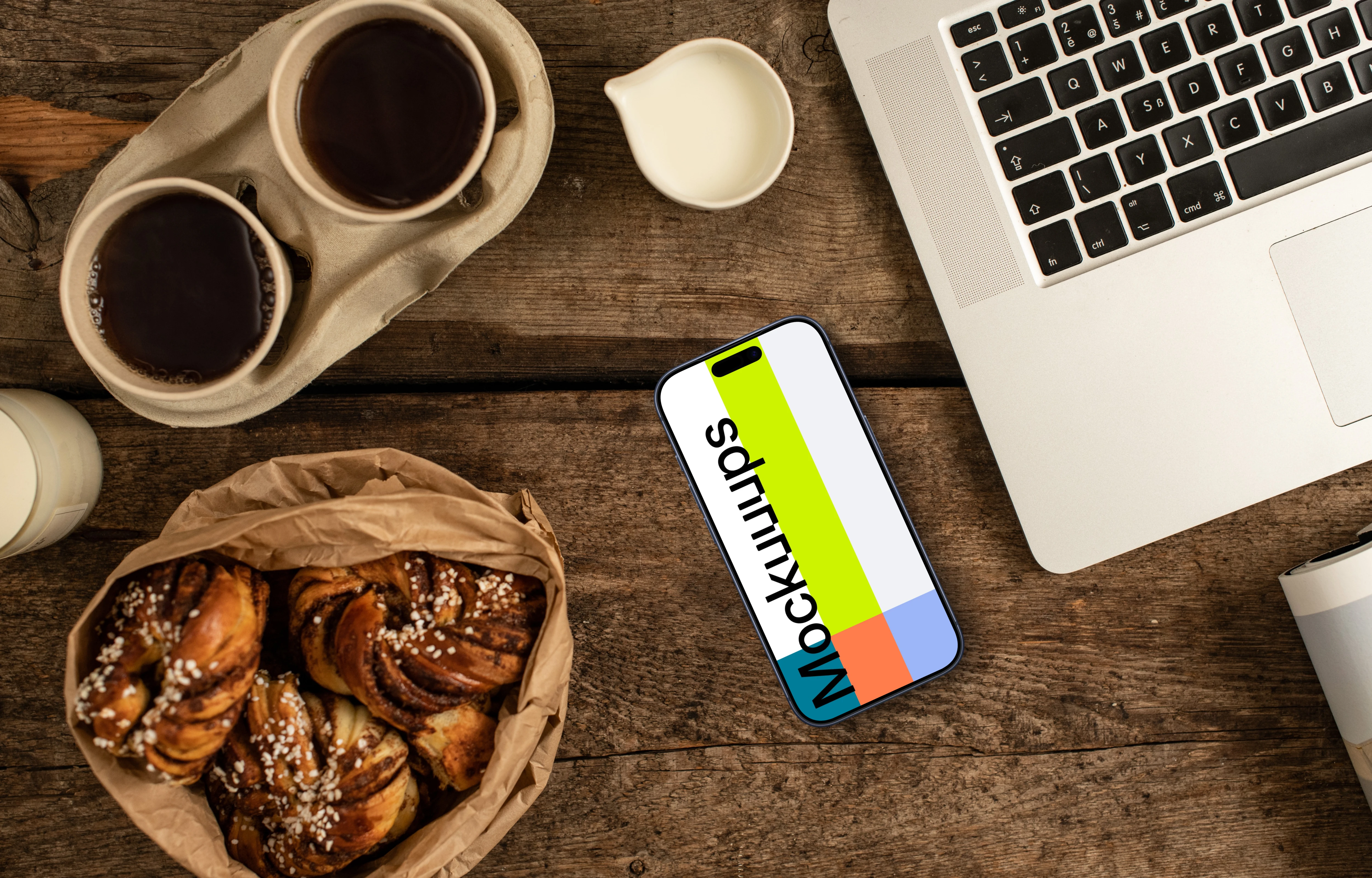 Smartphone mockup next to the coffee and pastries