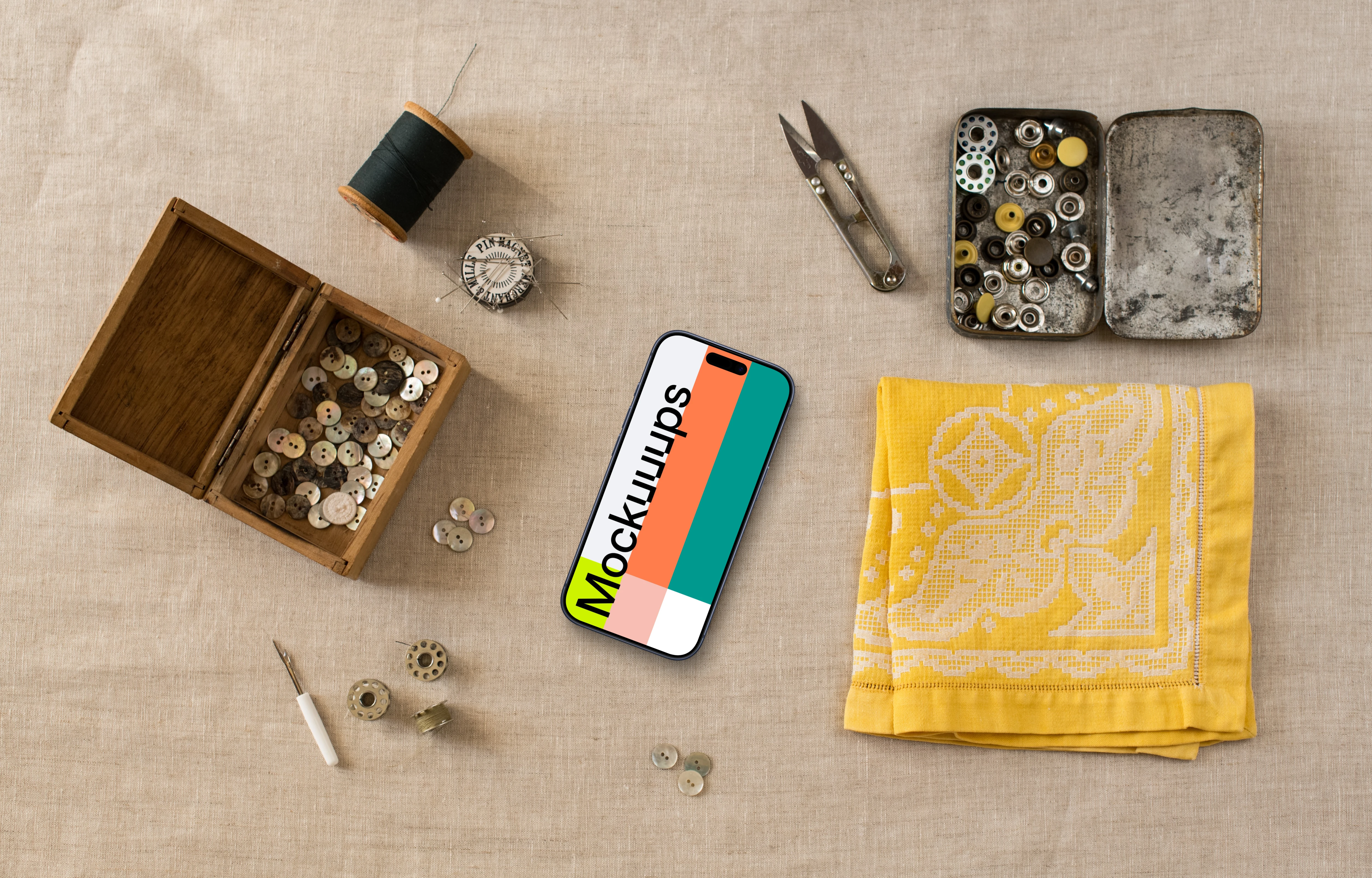 Smartphone mockup next to the yellow folded cloth