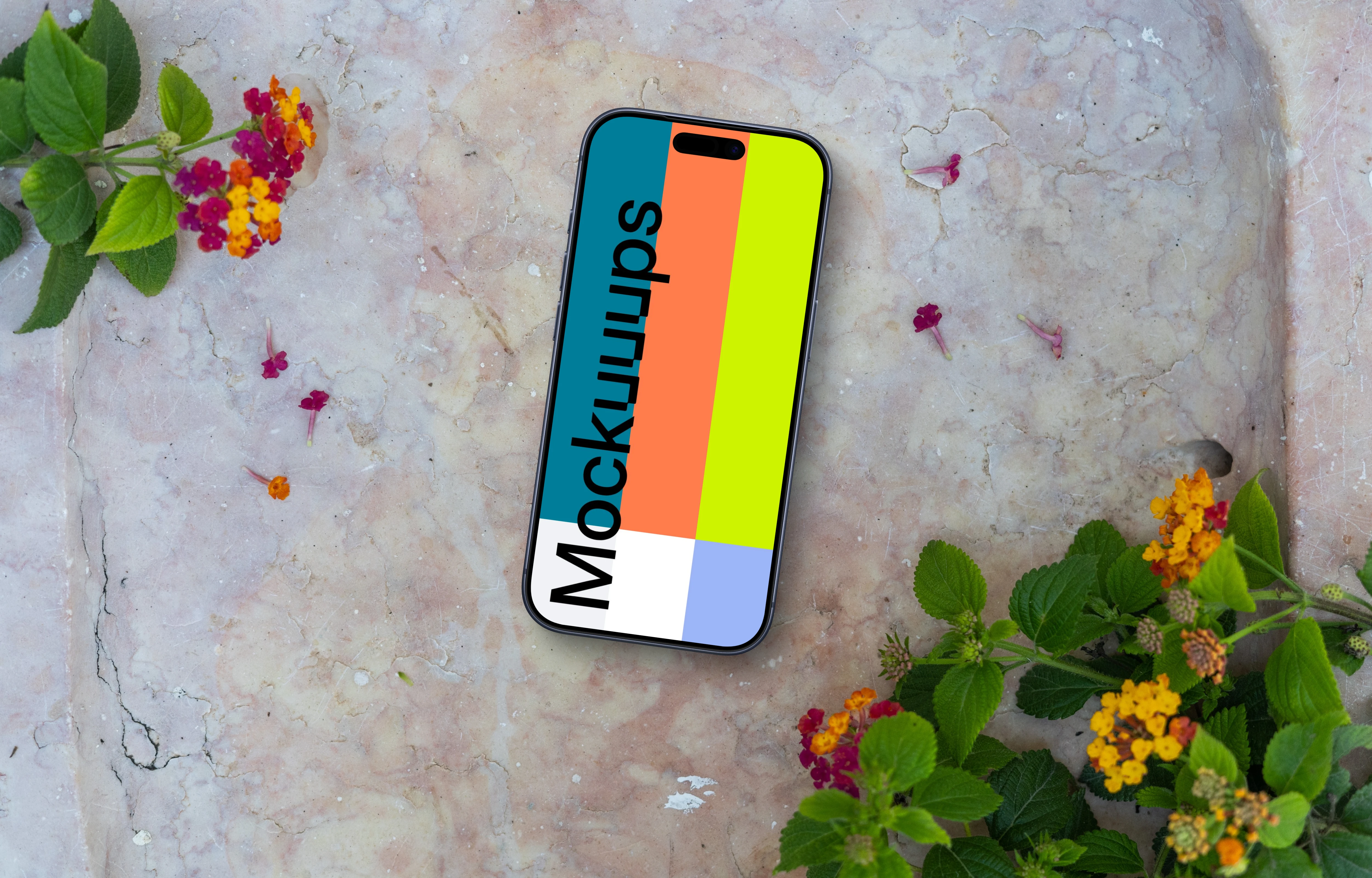 Smartphone mockup on a stone surface with flowers