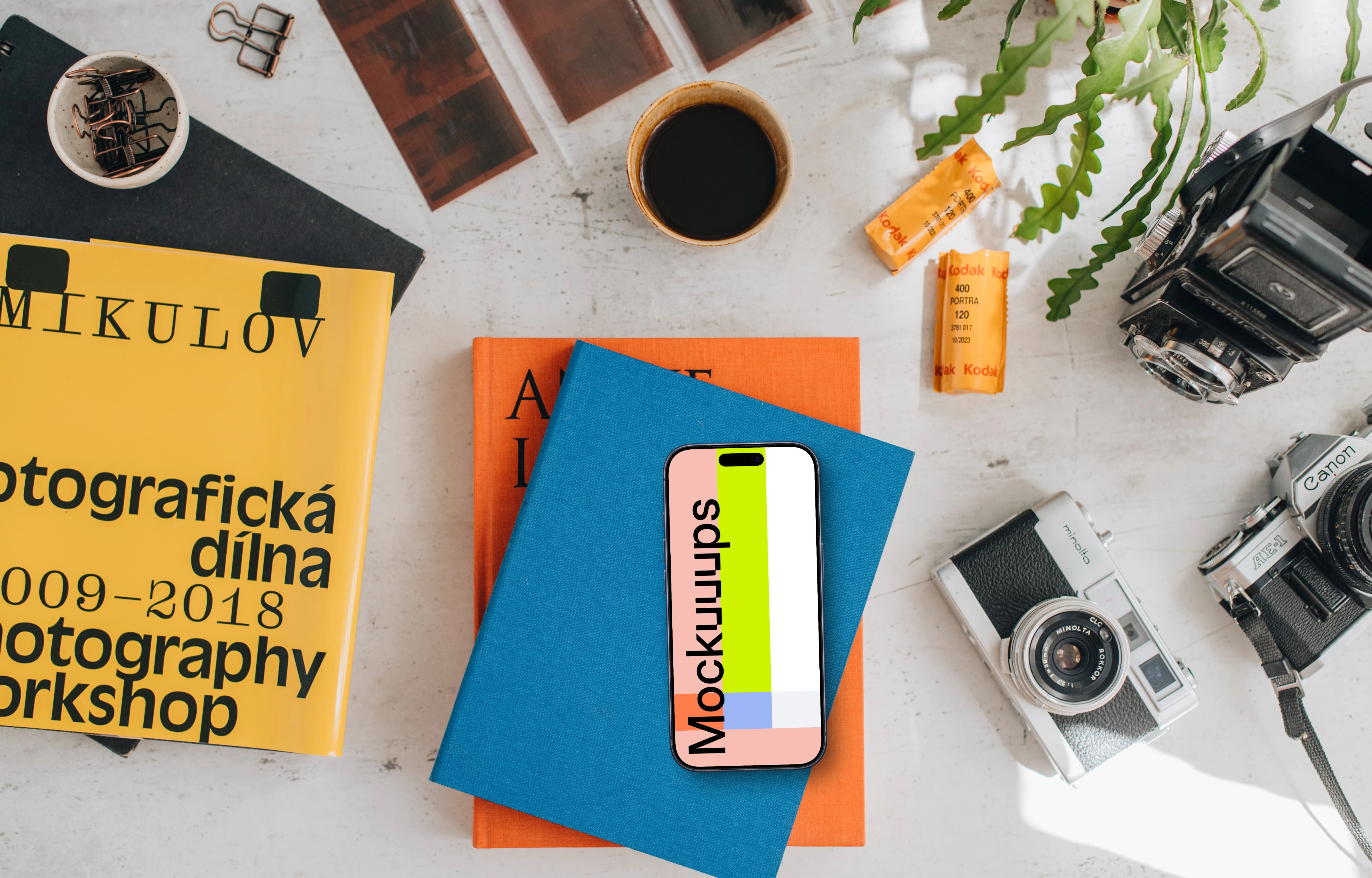 Smartphone mockup placed on colorful books
