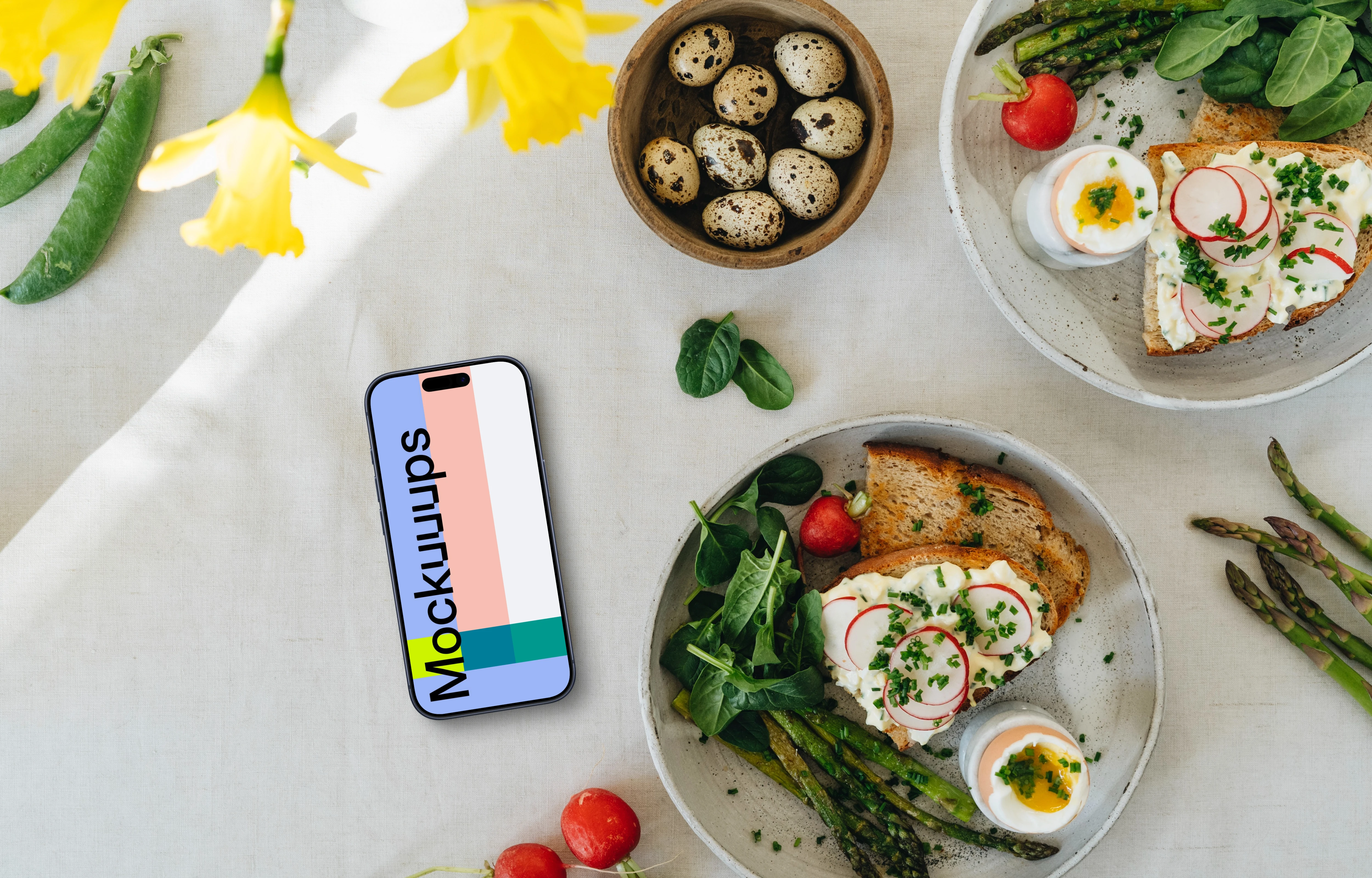 Smartphone mockup with Easter snack and yellow flowers
