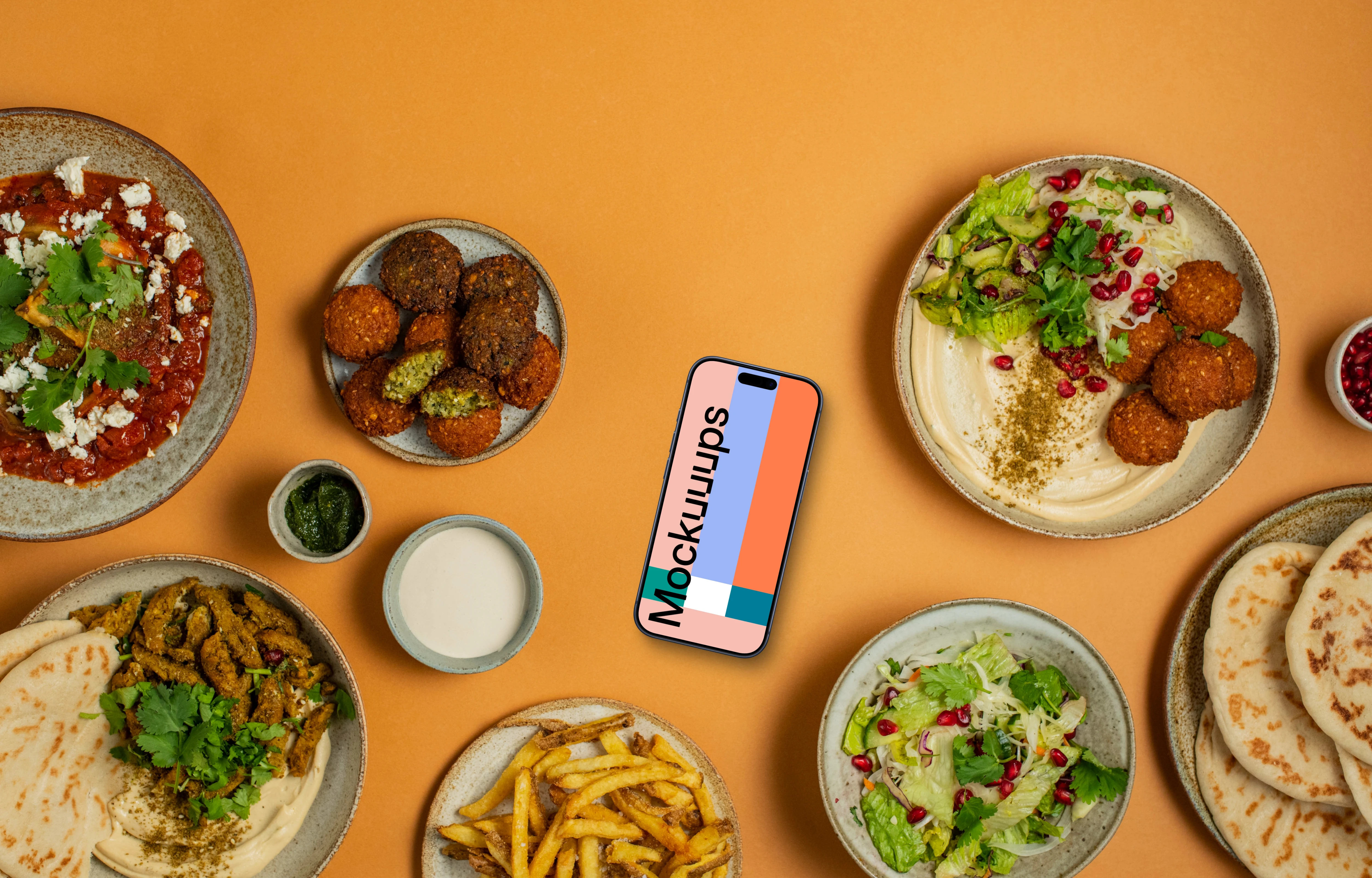Smartphone mockup with Middle Eastern dishes