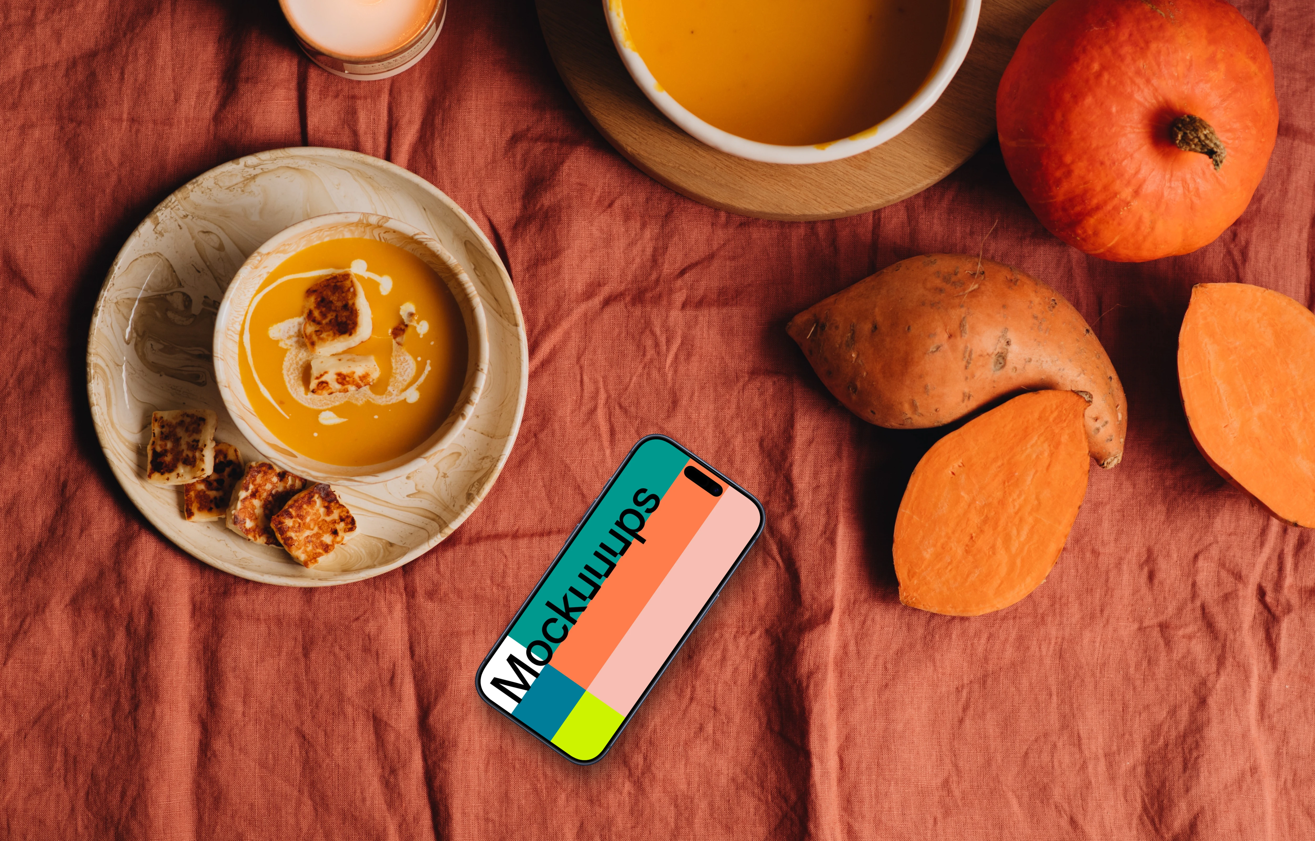 Top view of phone mockup next to the pumpkin soup