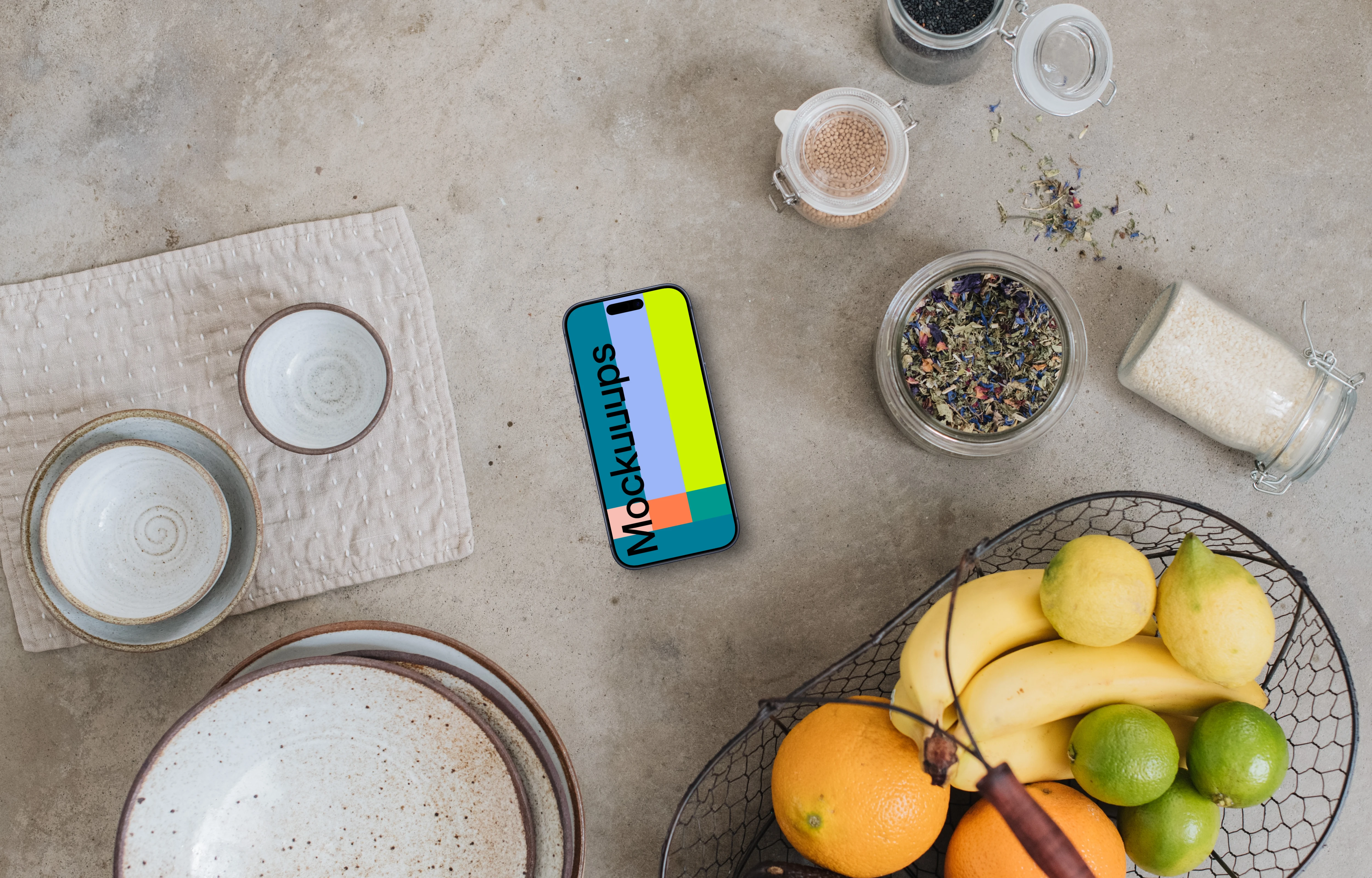 Top view of smartphone mockup next to the basket with fruits