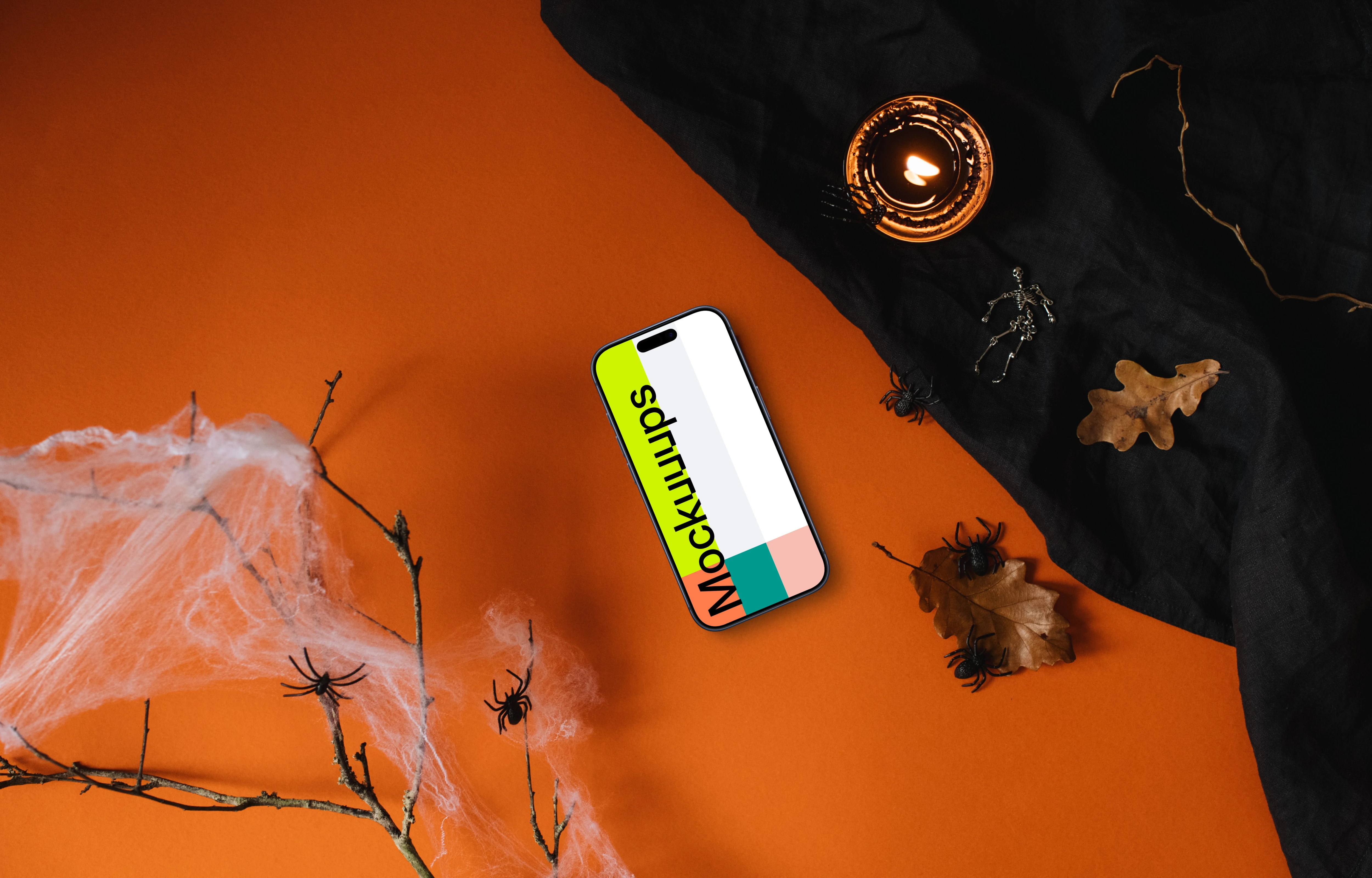 Top view of halloween table with a smartphone mockup
