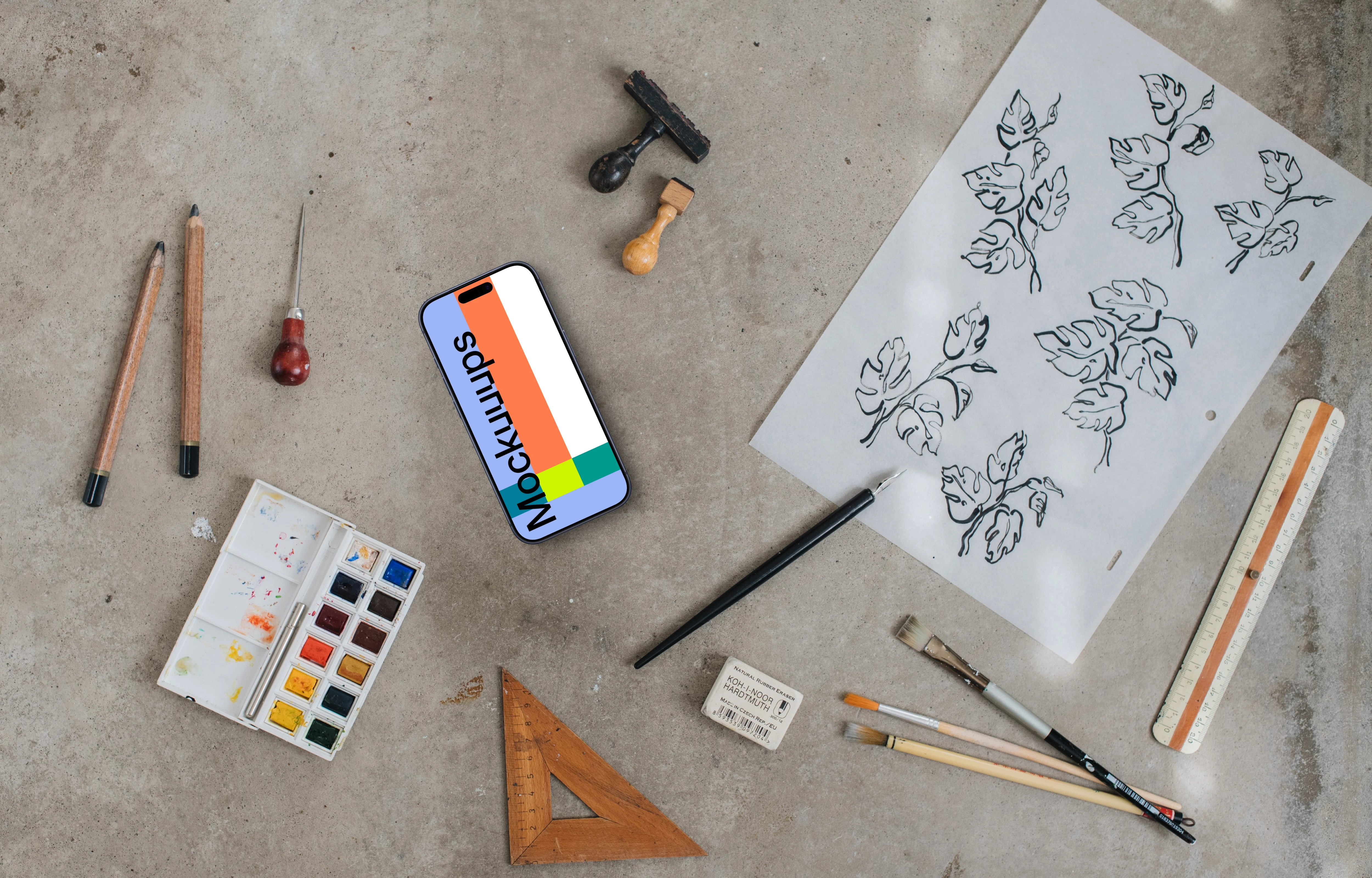 Smartphone mockup next to the painting accessories