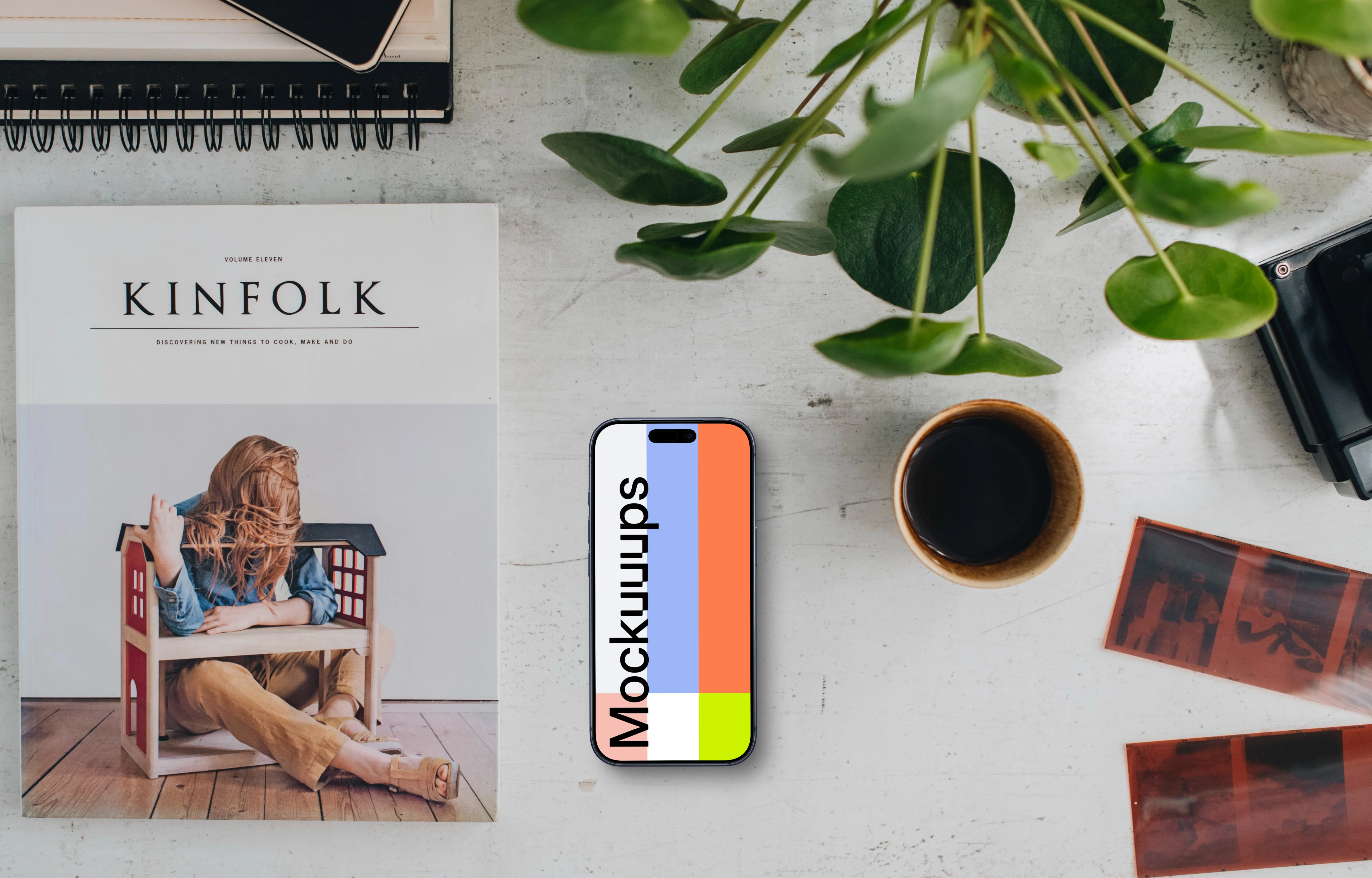 Top view of office desk with a phone mockup