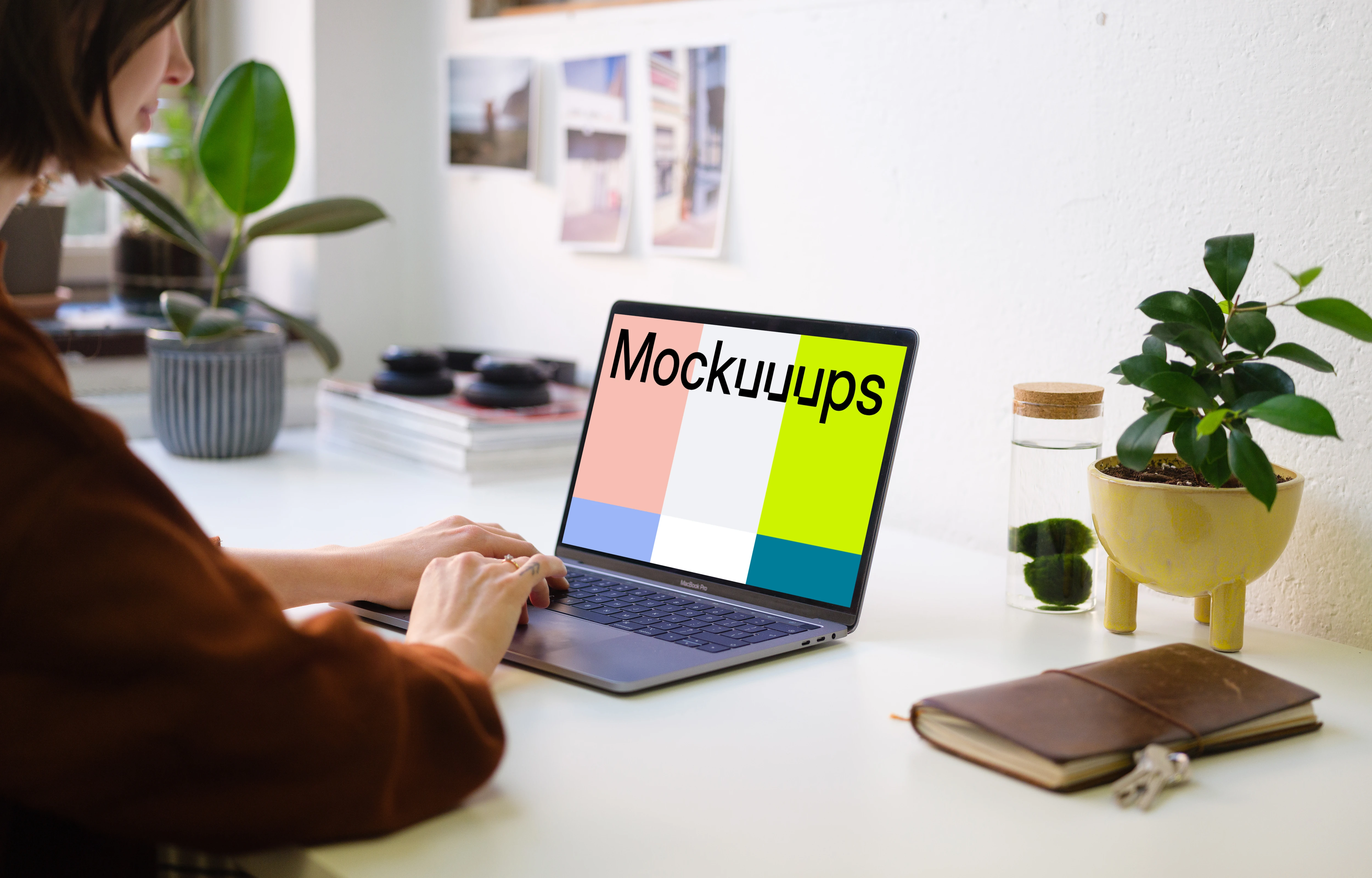 Young woman working on the Macbook Pro mockup