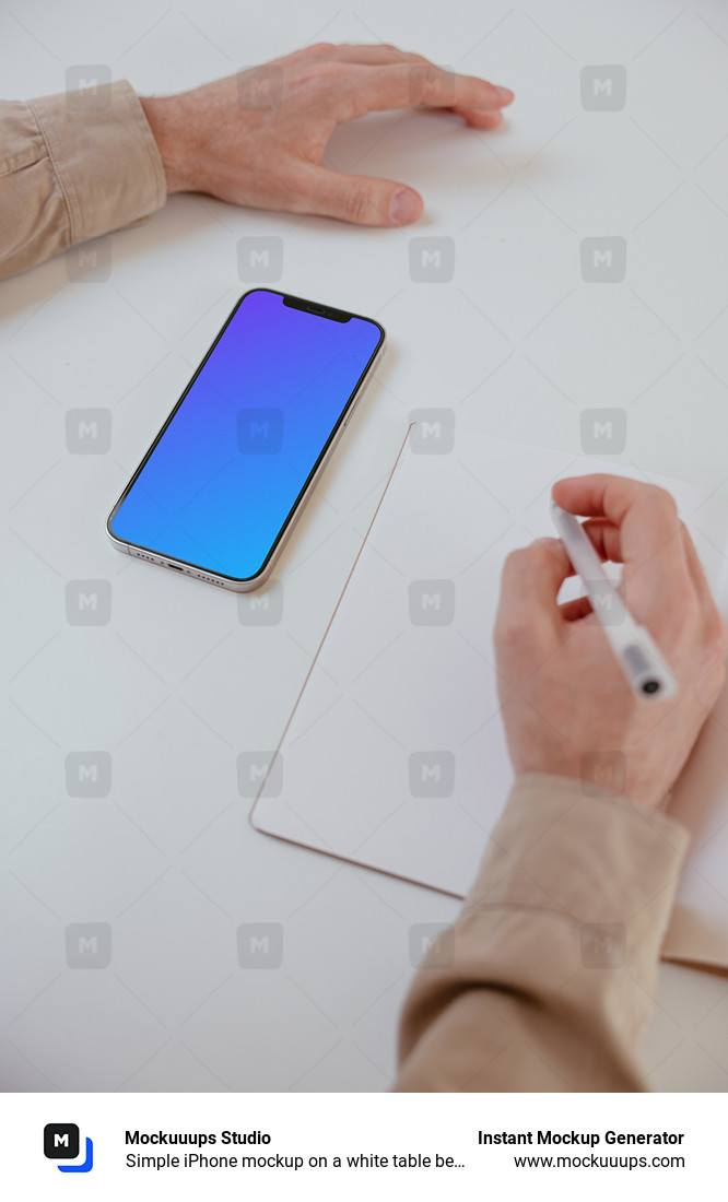 Simple iPhone mockup on a white table beside a book