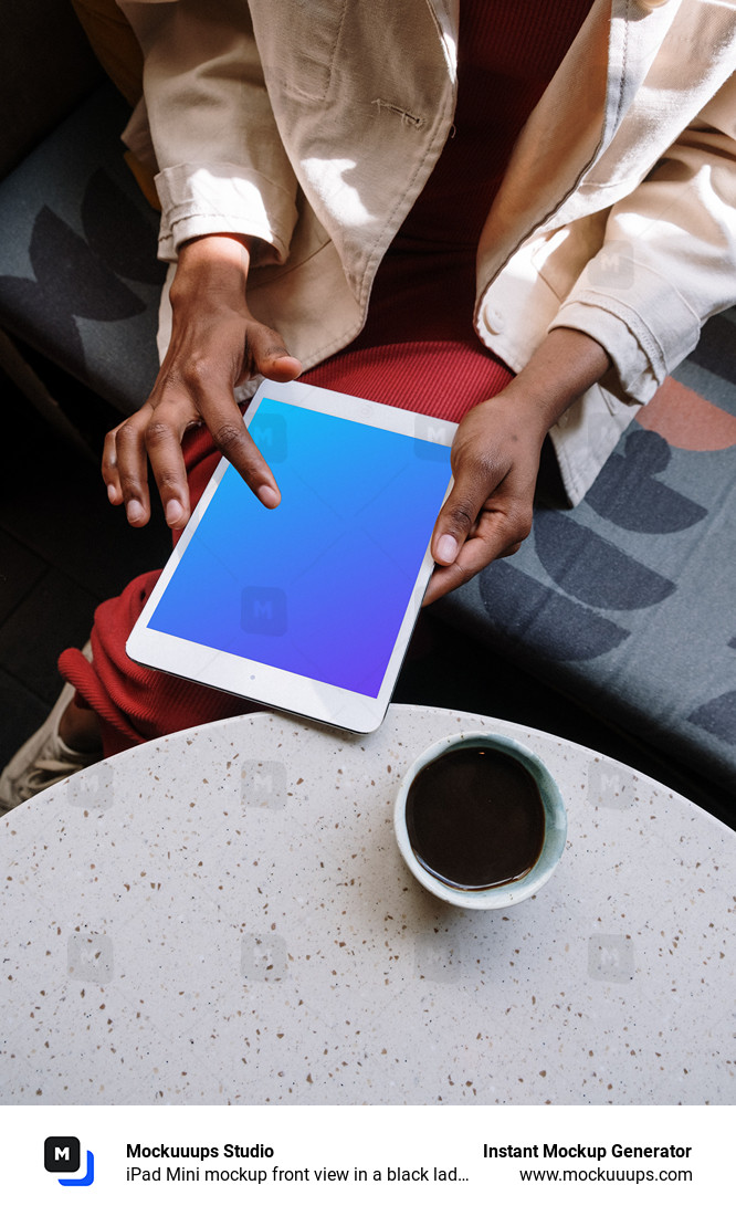 iPad Mini mockup front view in a black ladies hand