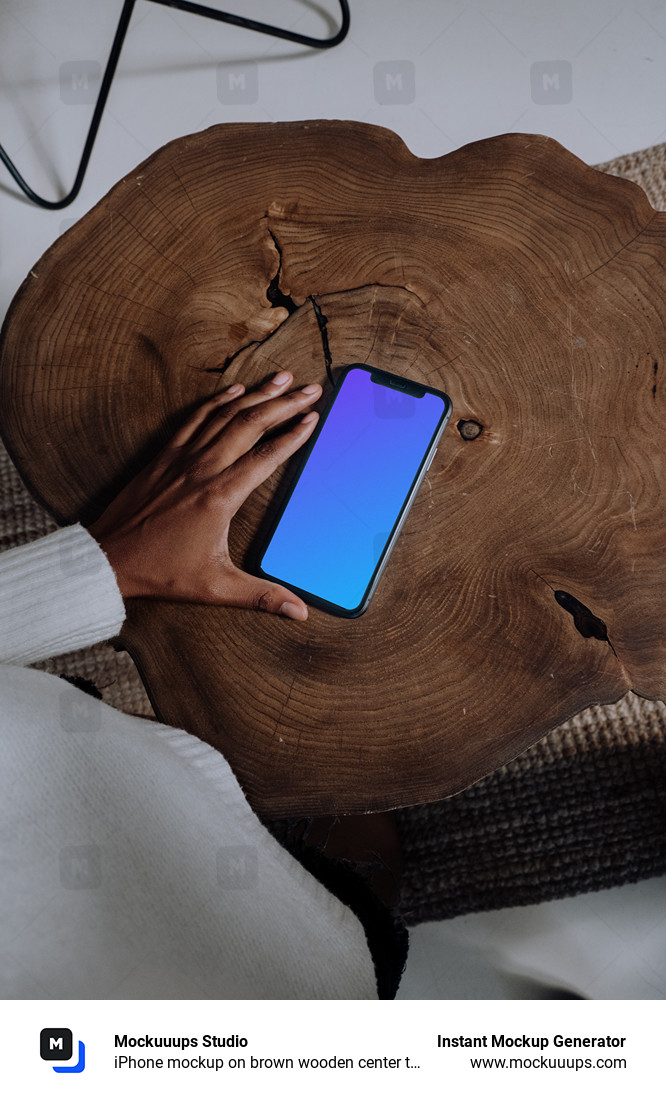 iPhone mockup on brown wooden center table