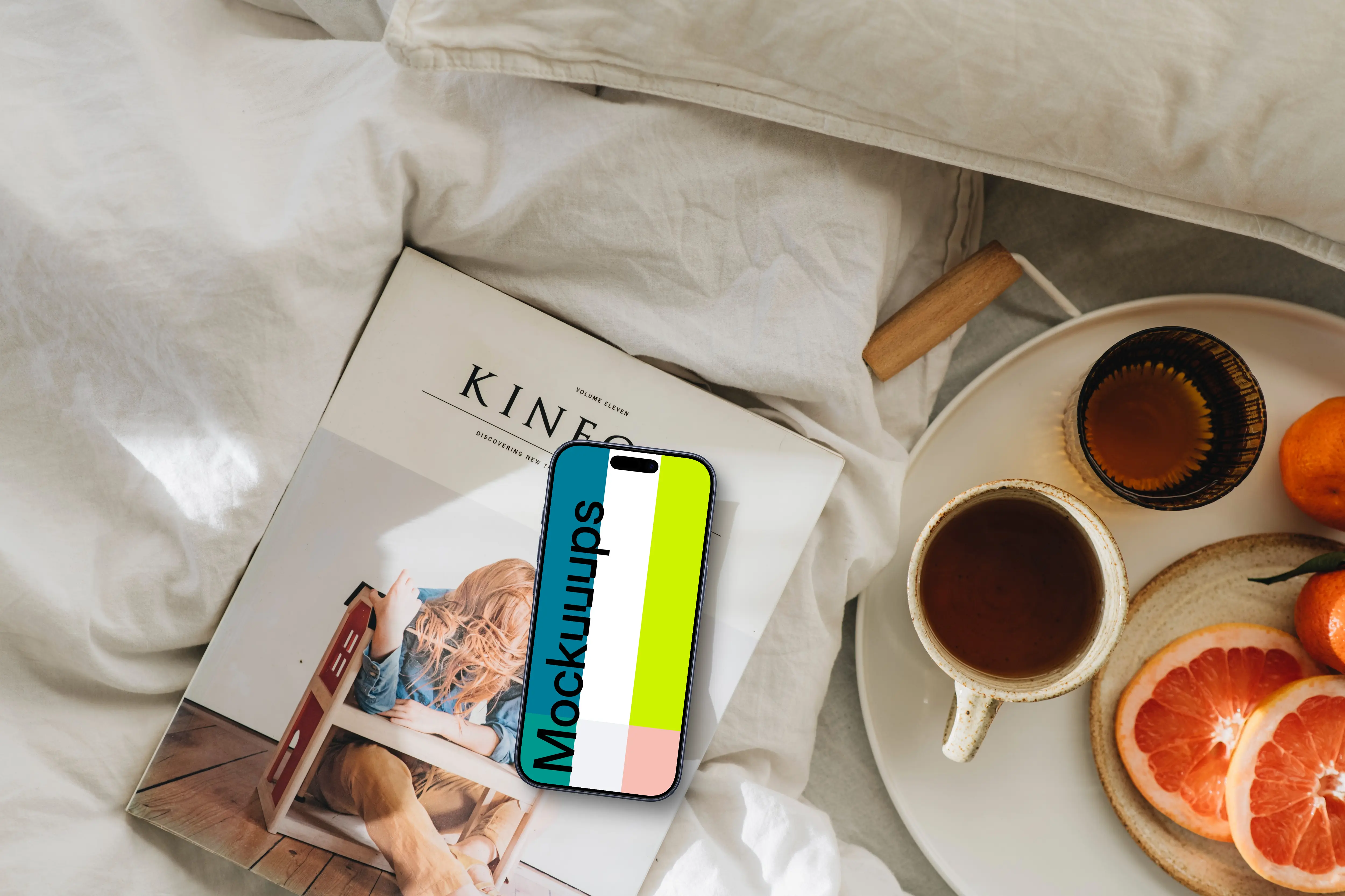 Breakfast in bed spread with an iPhone mockup